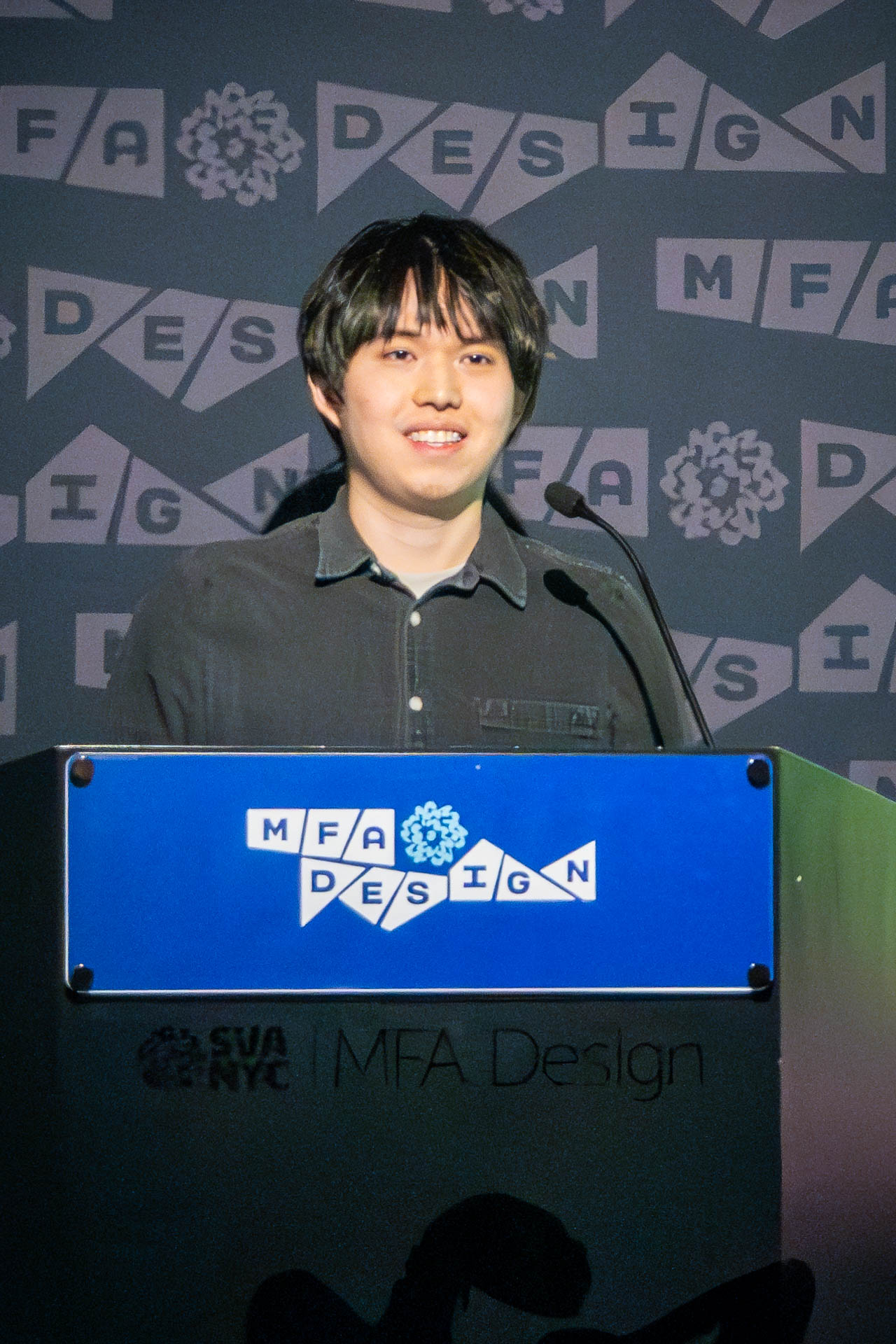 student at a podium giving a presentation