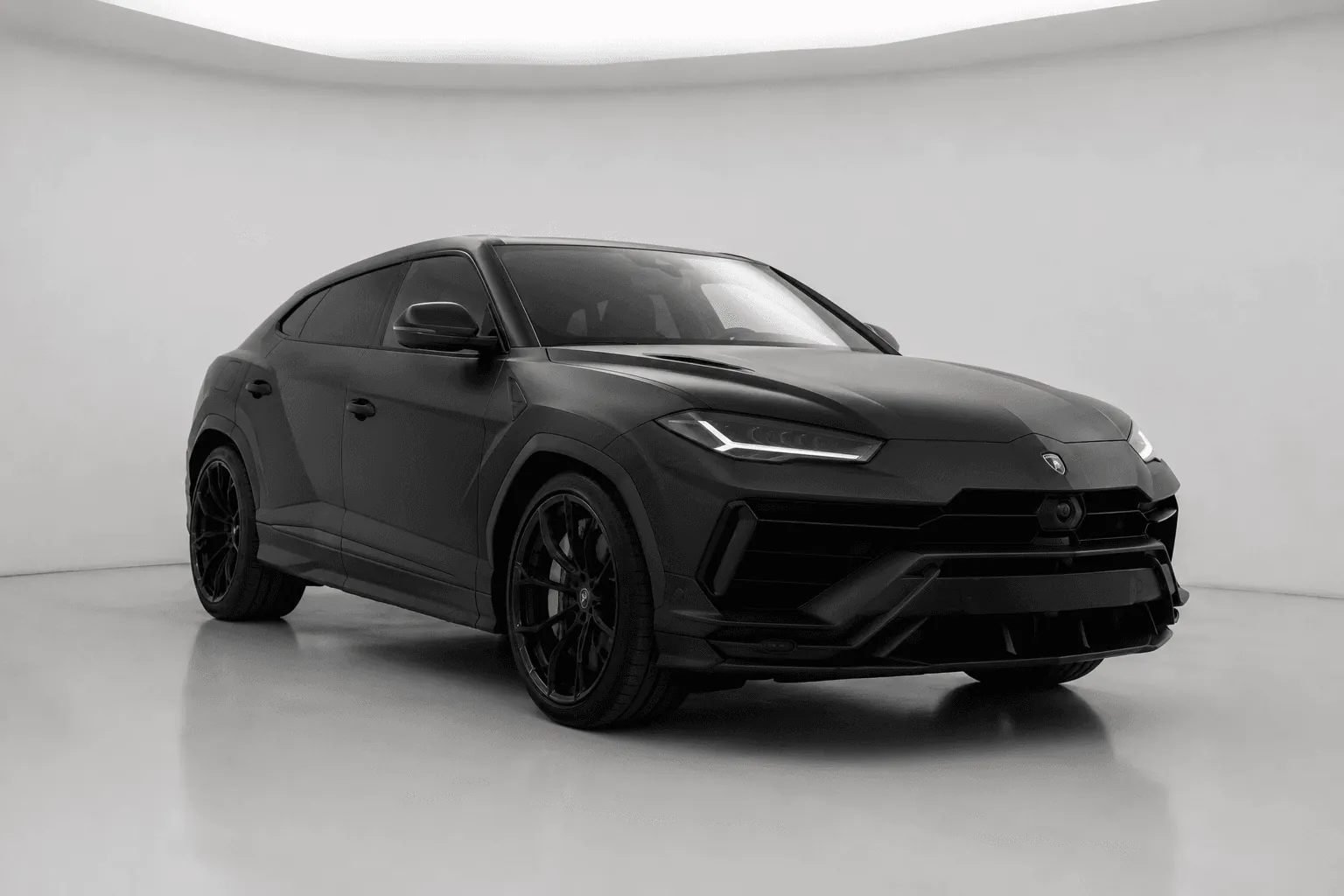 Matte black Lamborghini Urus SUV, front view.