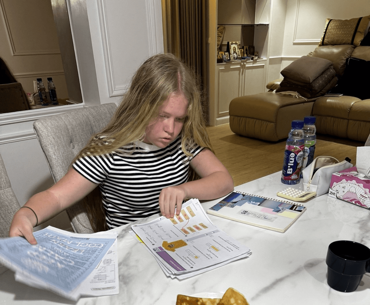 Photo of Ksenia, 11 years old, Root Square Academy student from South Korea, doing homework