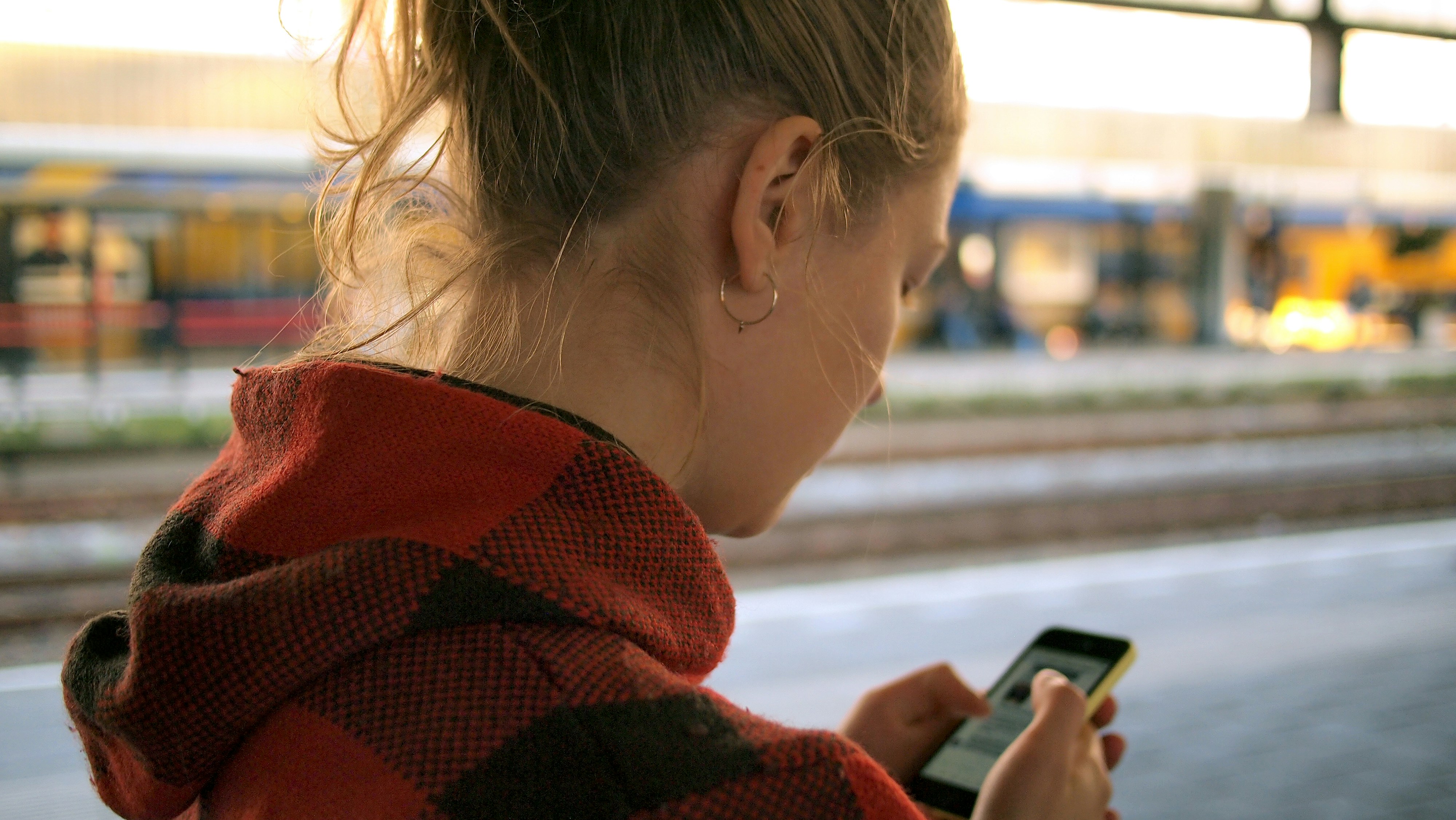 A woman holding her phone