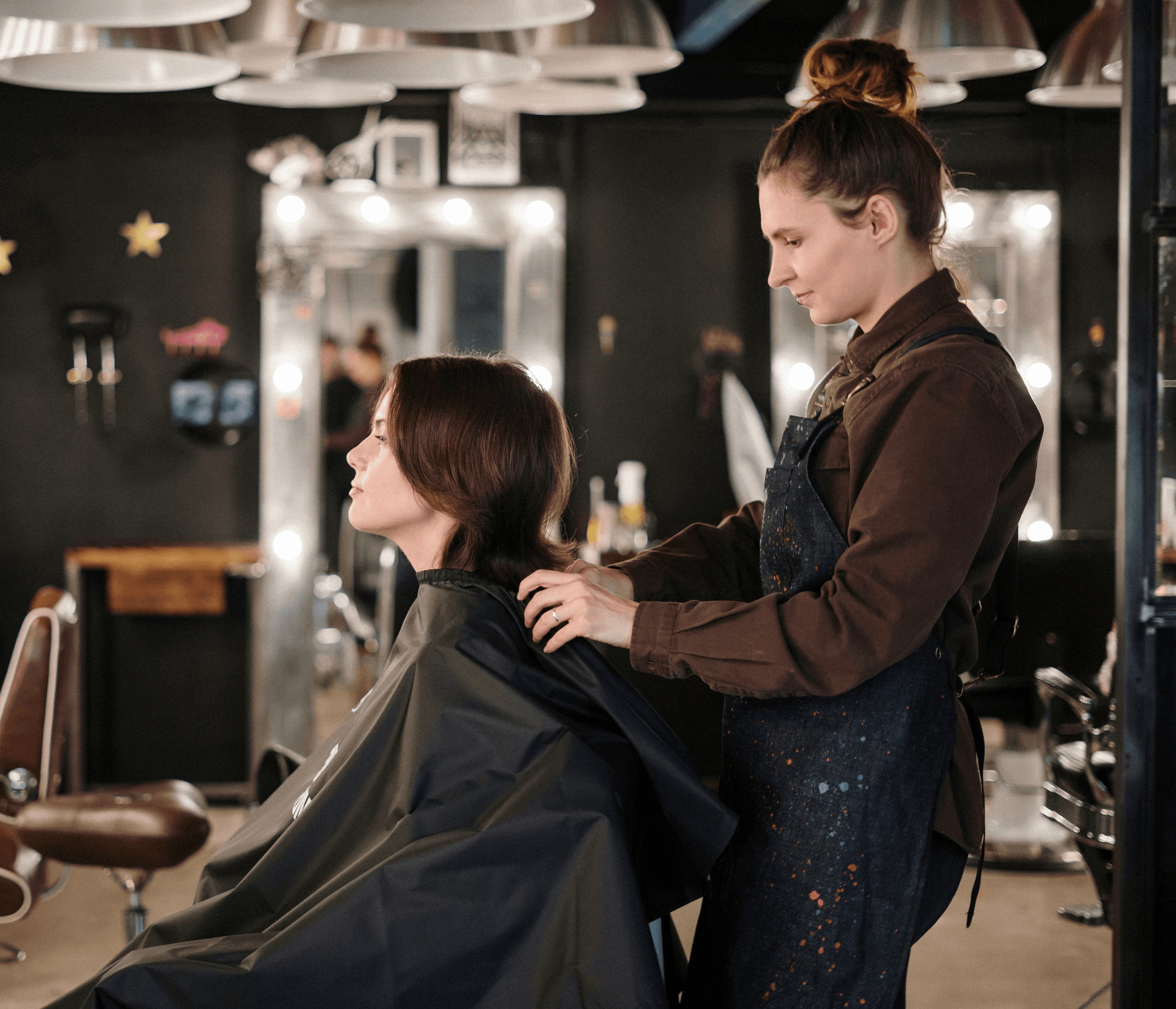 a-hairstylist-trims-a-client's-hair-in-a-modern-salon-setting,-capturing-a-momen - cottonbro-studio (pexels)