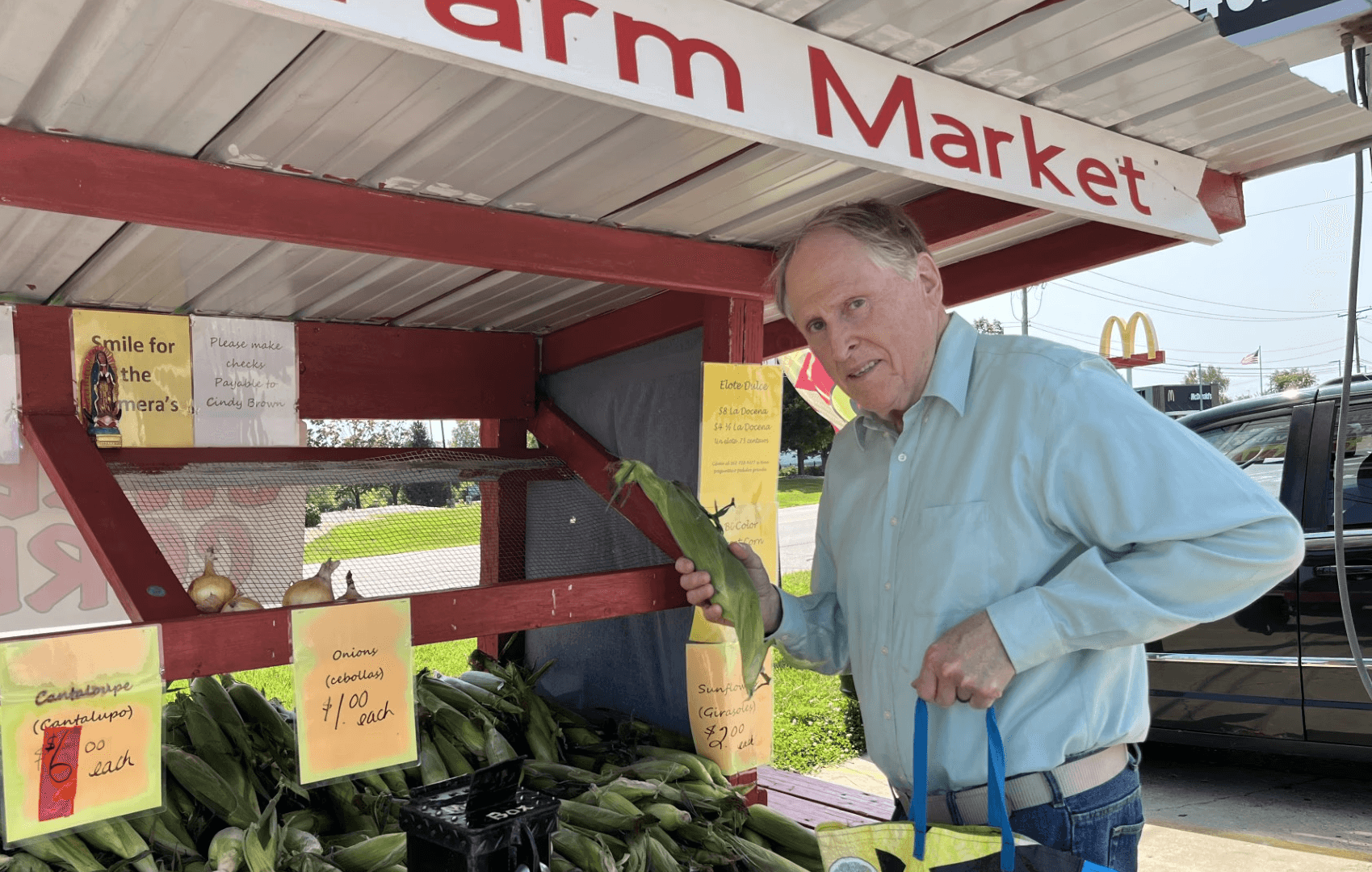 Scott Summers at a local farmstand purchasing corn