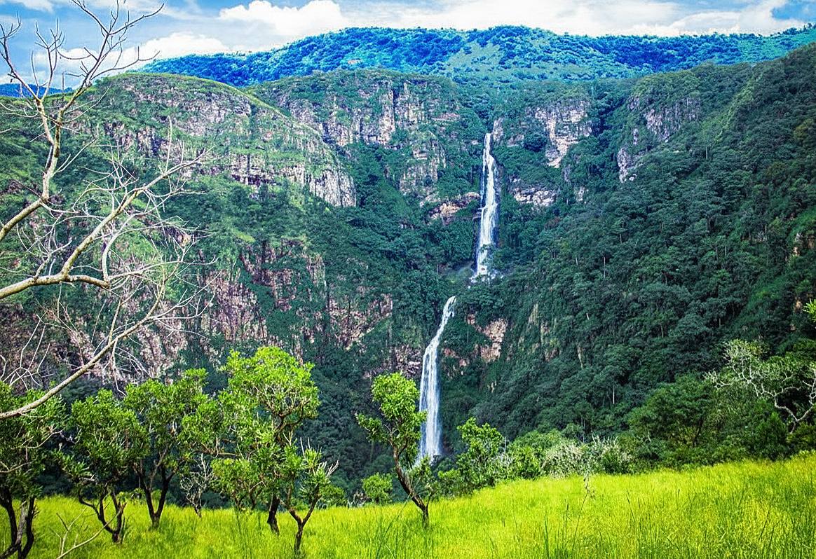 A skateboarder is doing a trick in the air