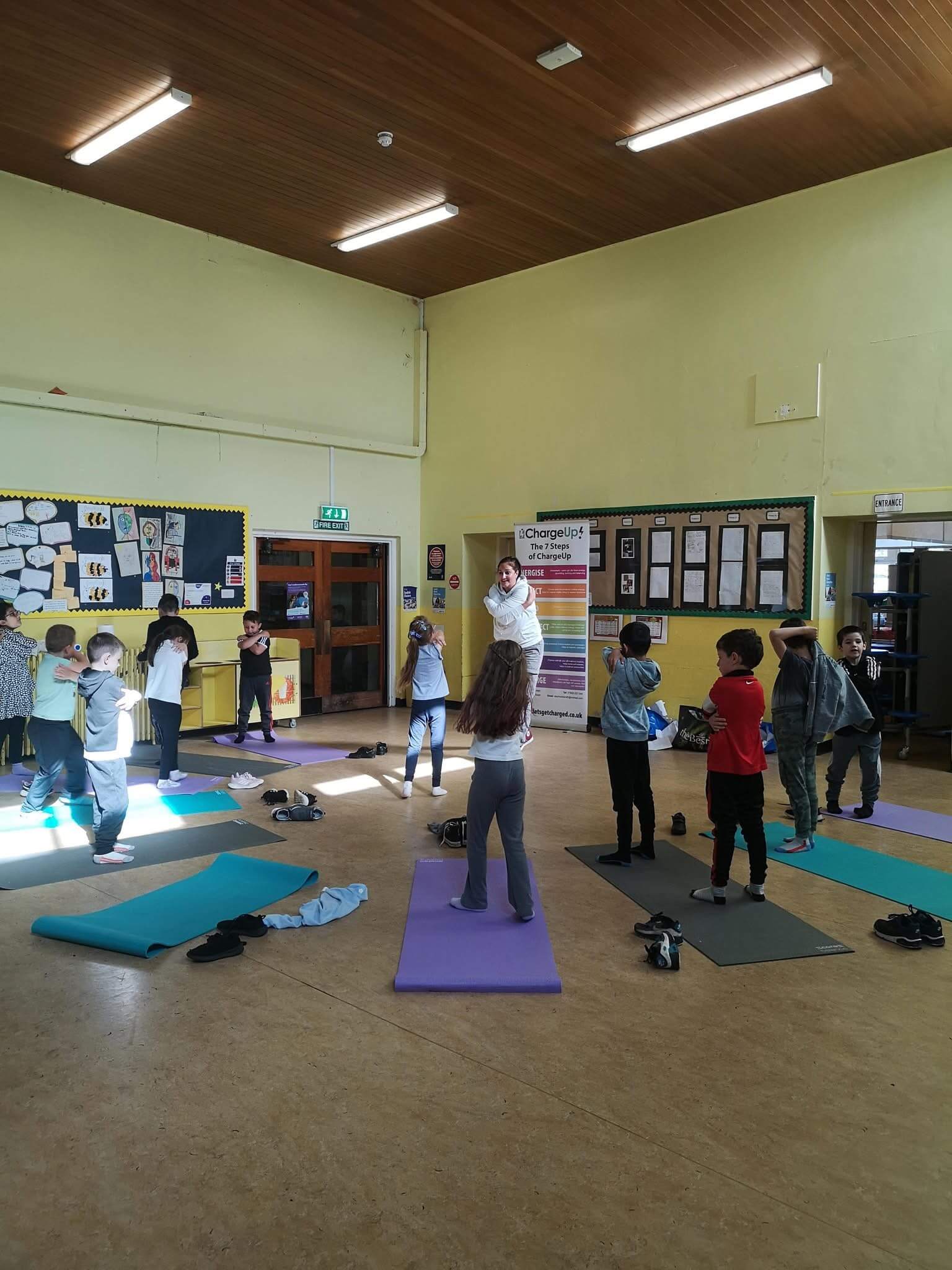 A group of kids doing exercises with Steph