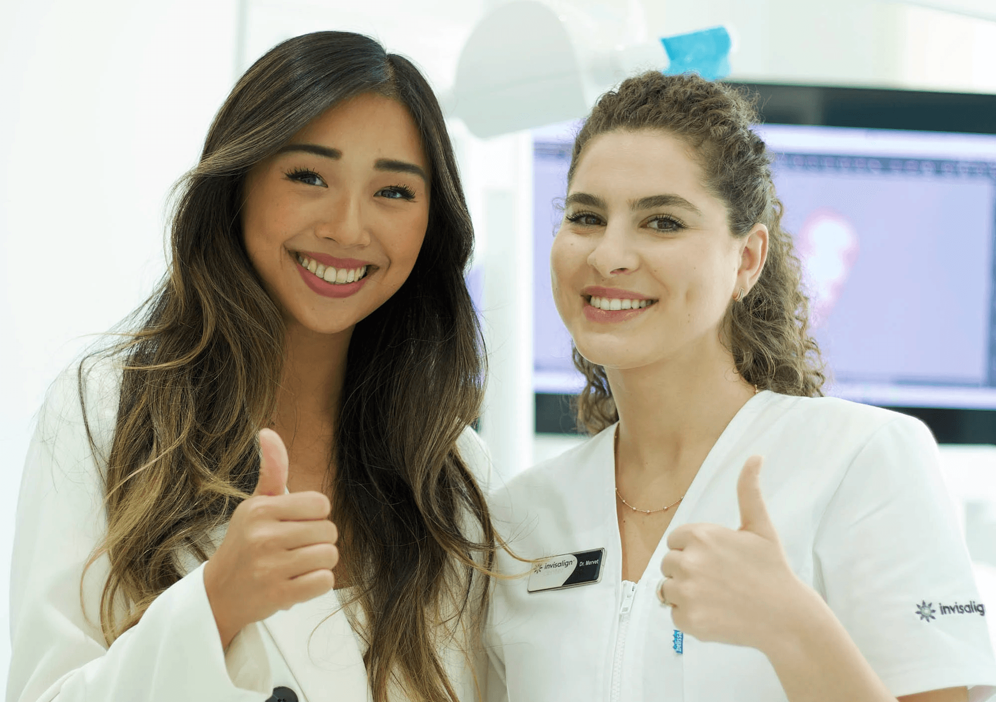 Invisalign Center expert dentists showcasing their Hollywood smiles