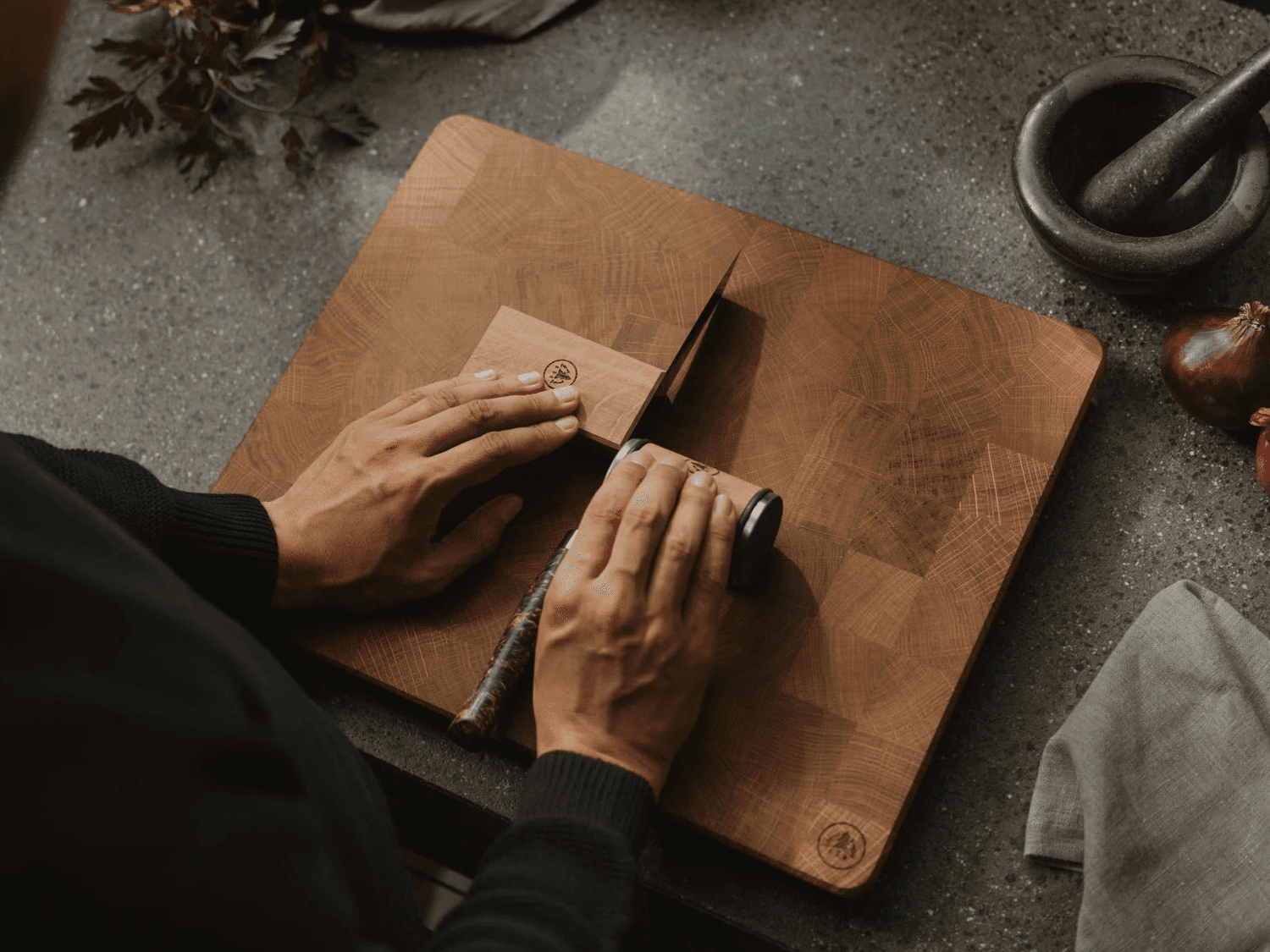 Placing the HORL® Leather Strop on a flat, stable surface in preparation for knife stropping.