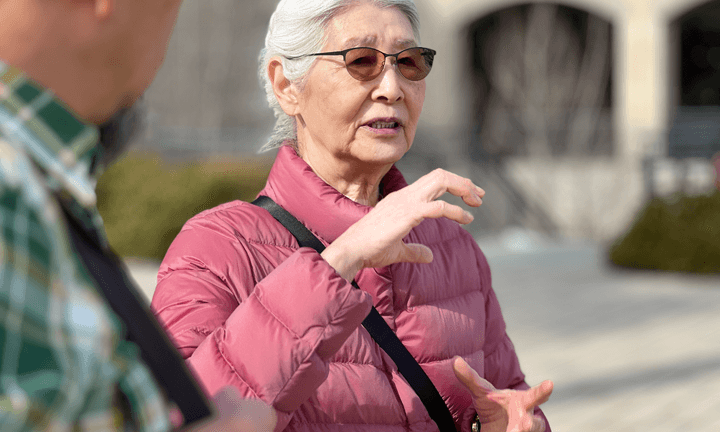 Older adult shares lived experiences with a Public Works team member during ethnographic research to better understand aging in place.
