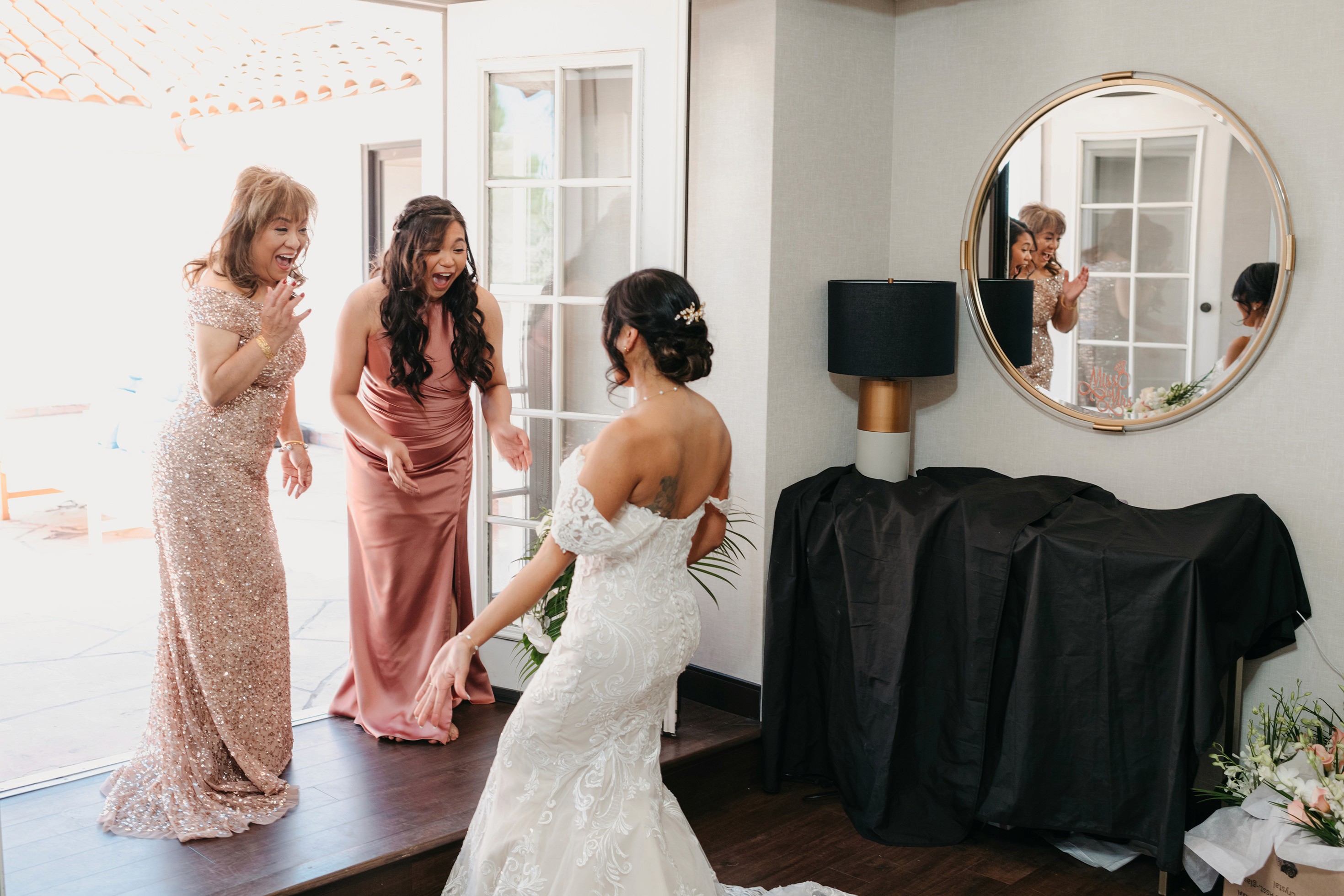 Flat lay wedding details with bouquet, rings, and sparkling bridal heels