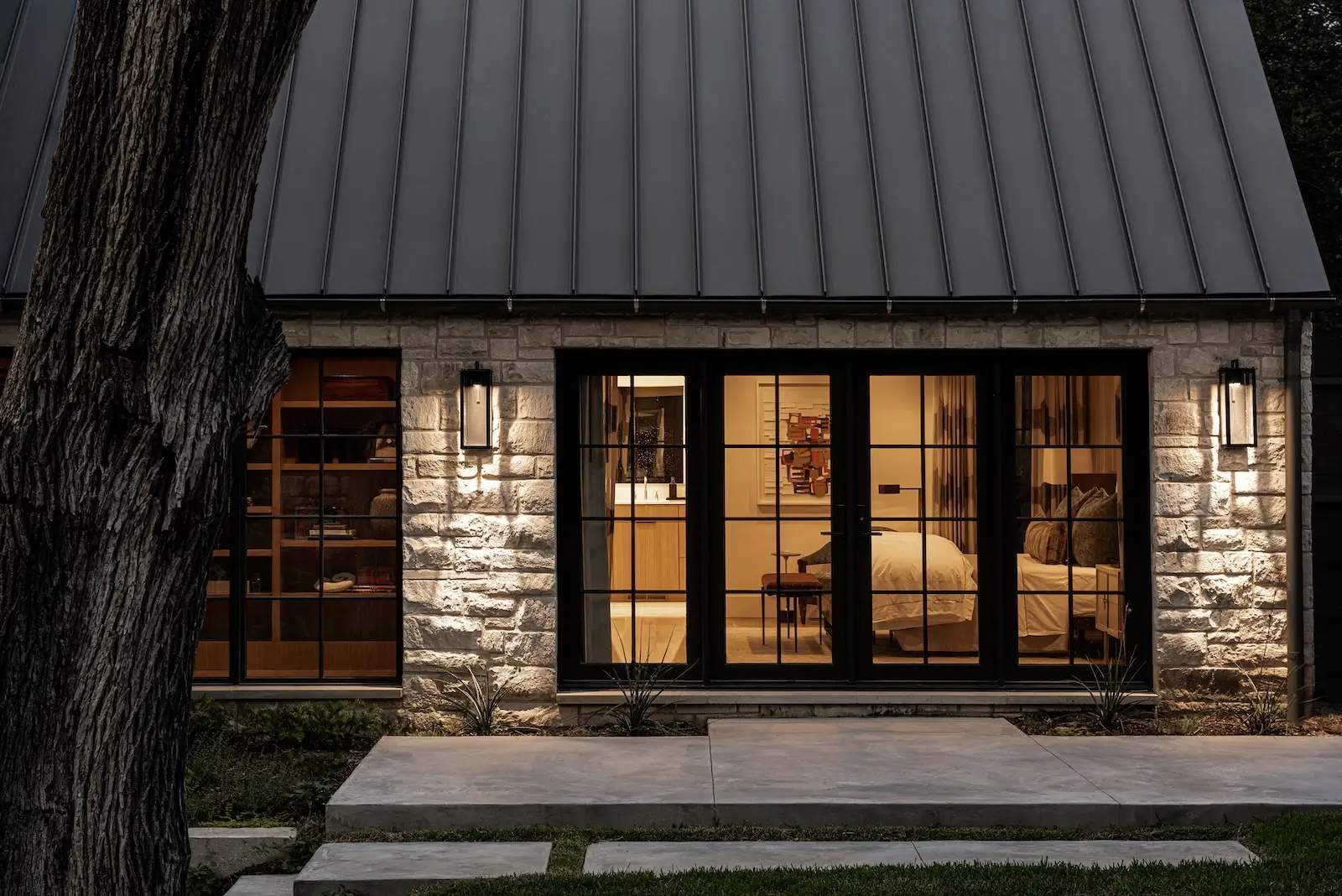 Standing seam metal roof on a Kessler Park, Dallas home framed by mature trees