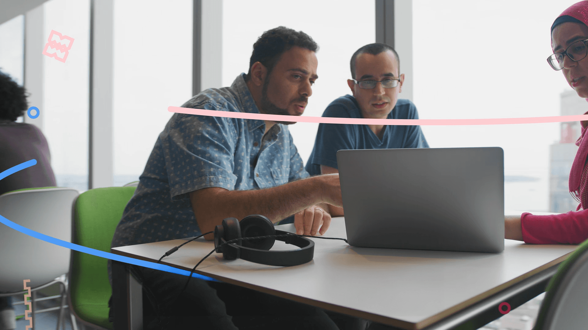 Creative team collaborating around laptop with abstract animated lines symbolizing connection