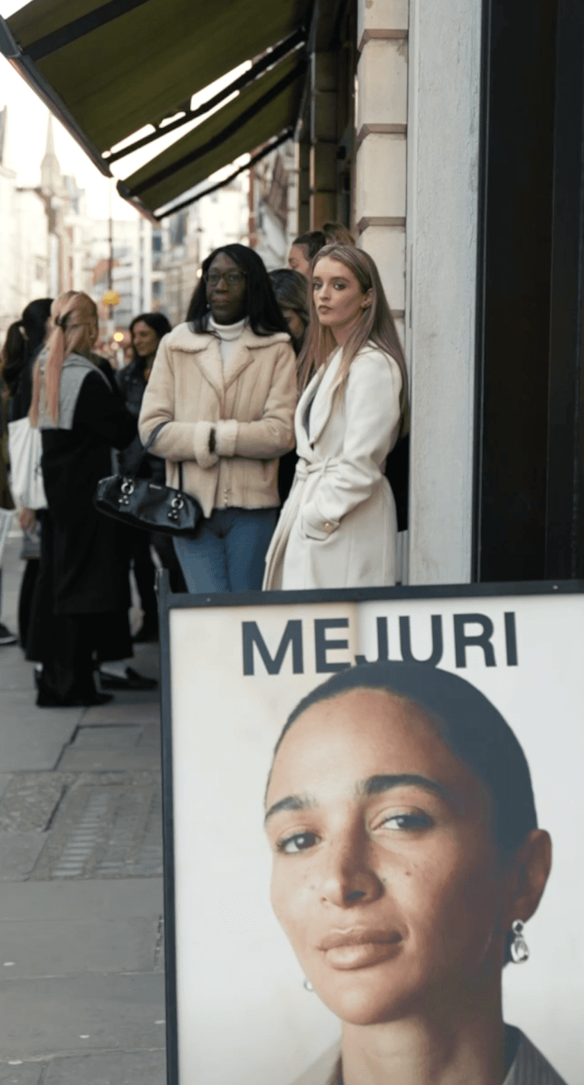 Bride in white dress walking on street, blurred motorcycle passing