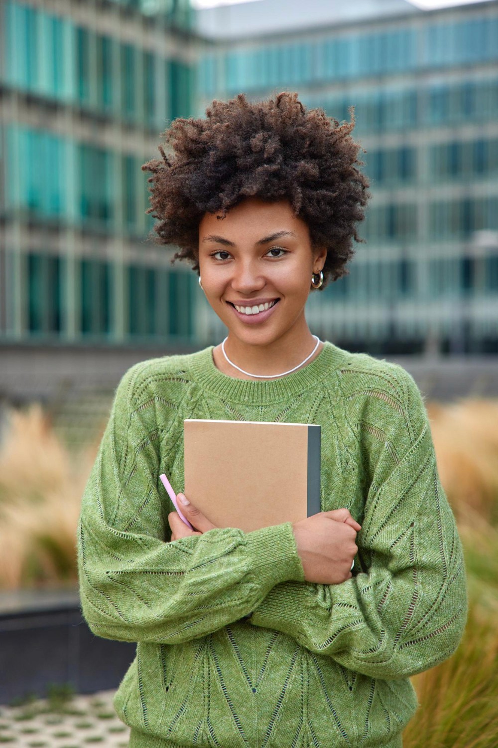 A female student holding a book