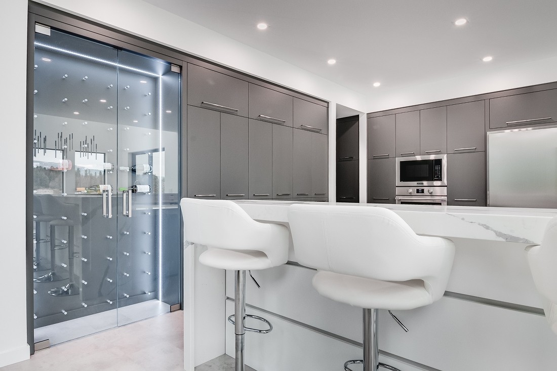 Modern kitchen with digital screen and sleek finishes