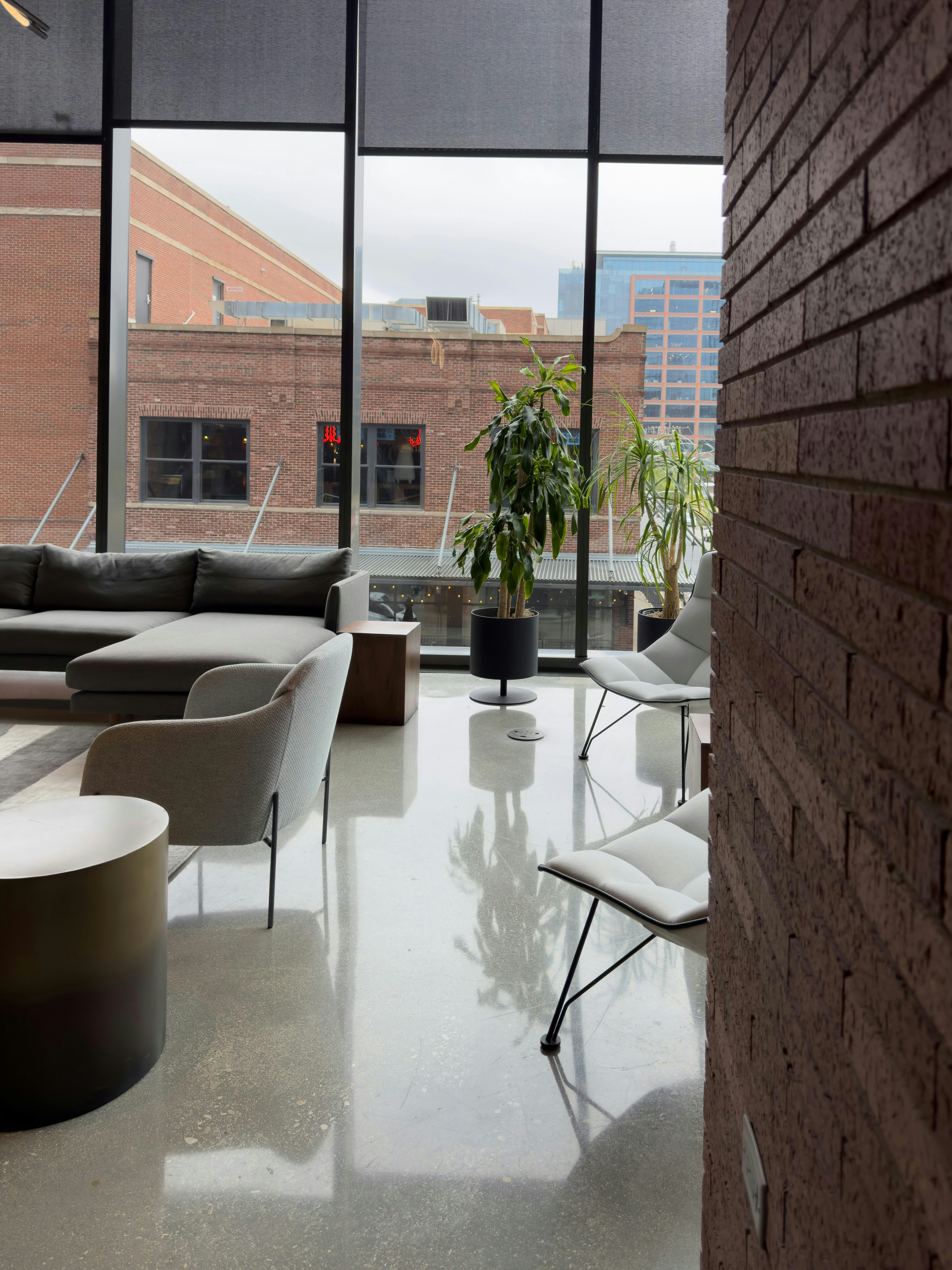 Modern lounge area with large windows and city view