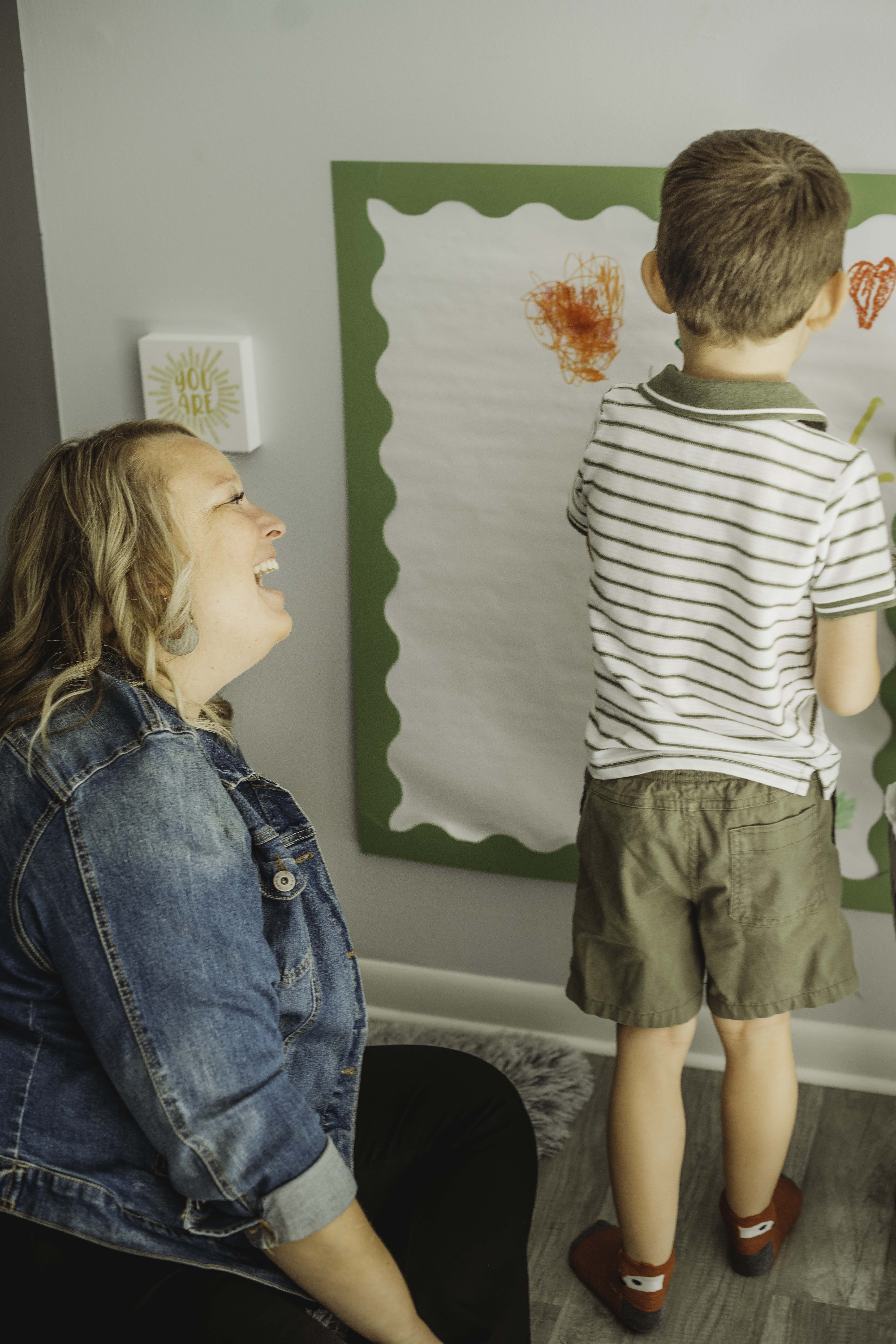 A student is writing in a notebook, concentrating on her work