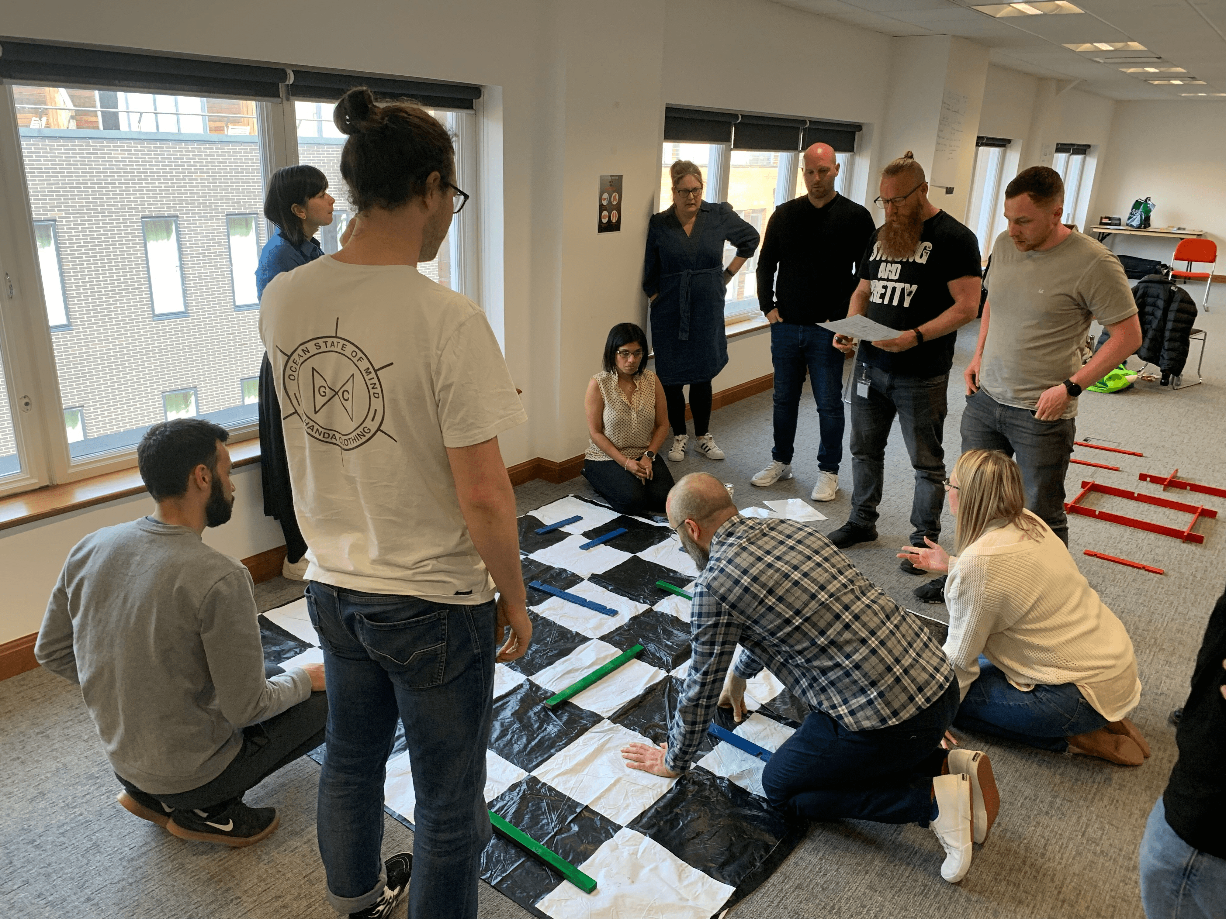 People playing a board game in an indoor area.