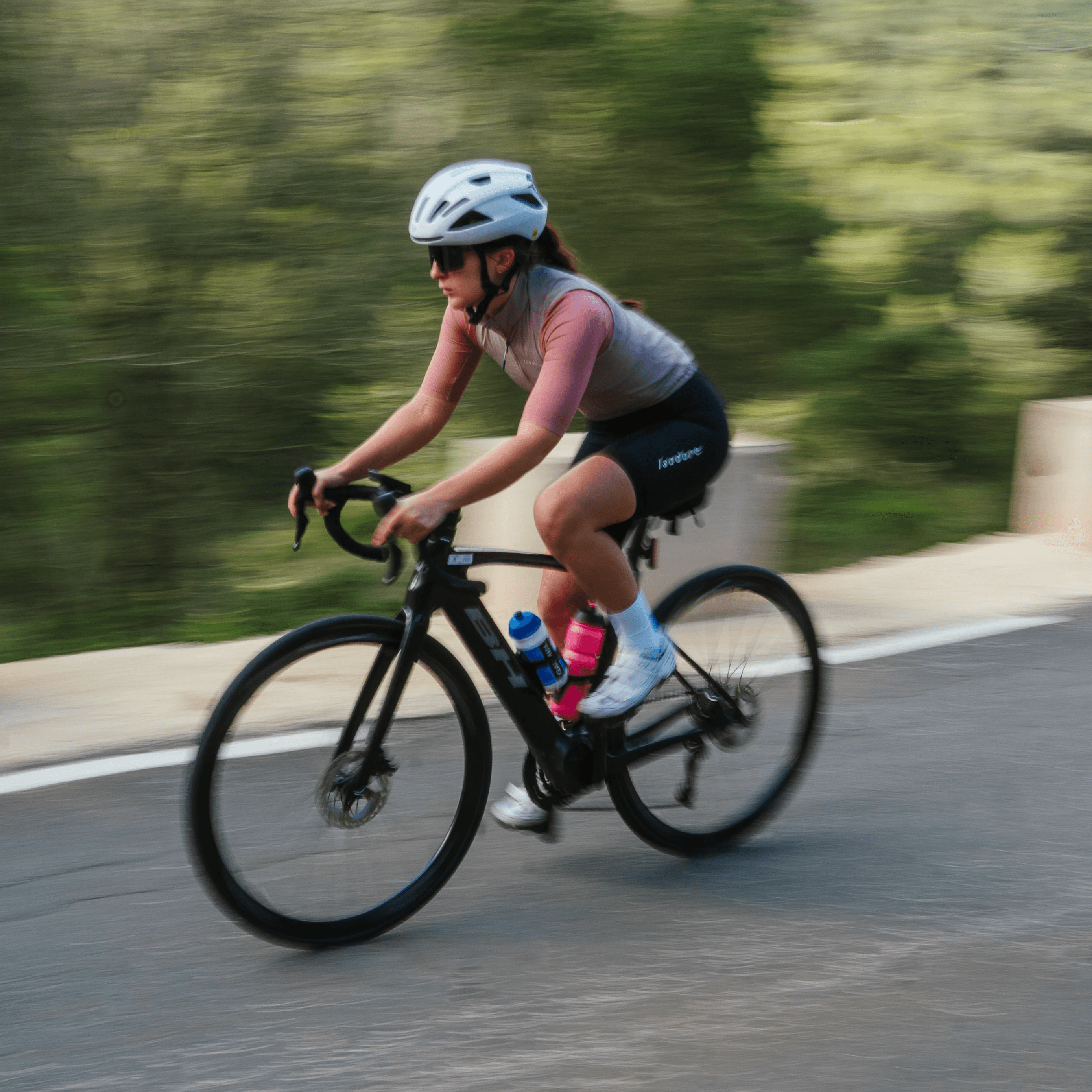 dynamic shot of a woman on a road bike.