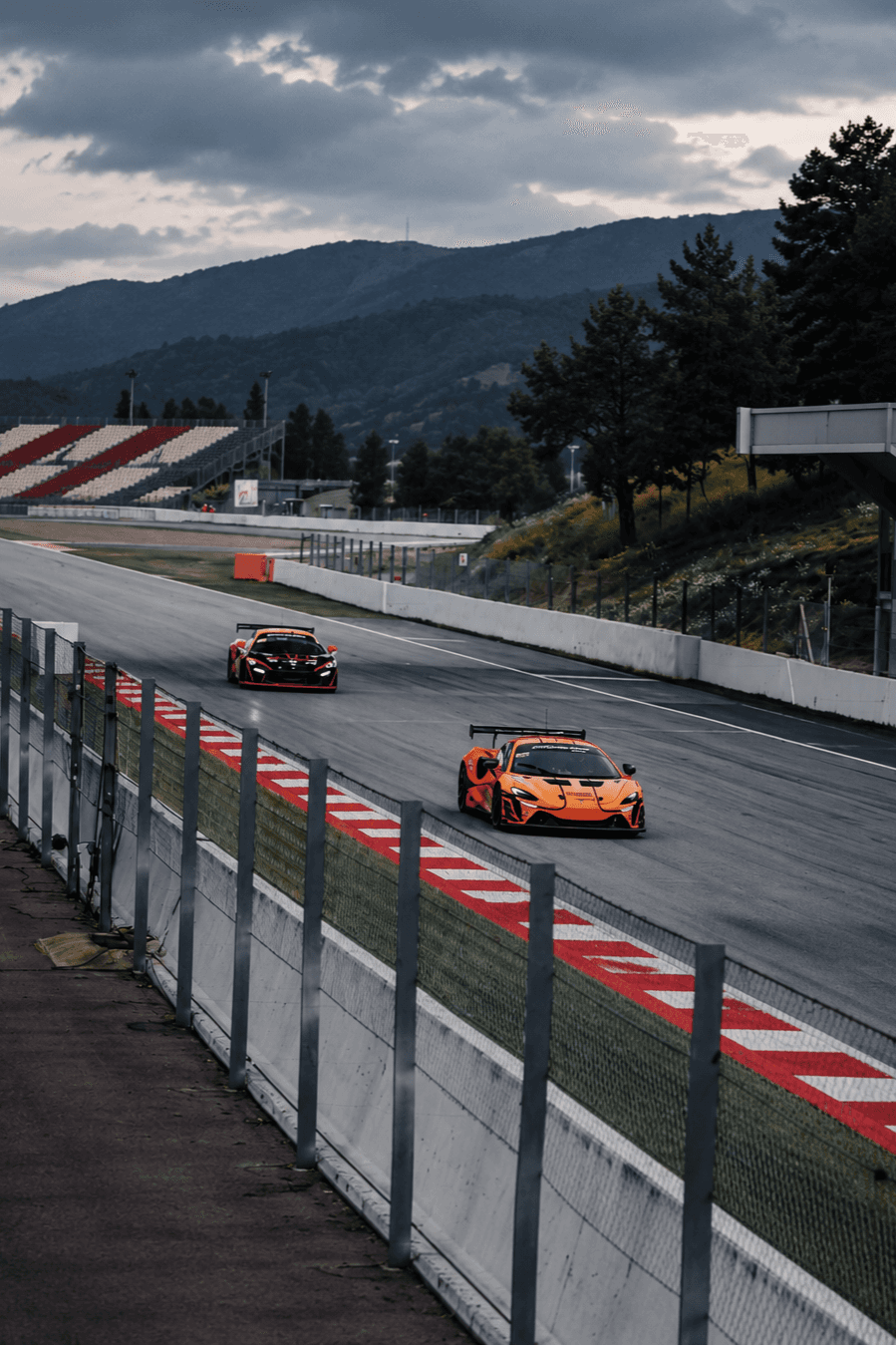 McLaren race car on track during a motorsport event.