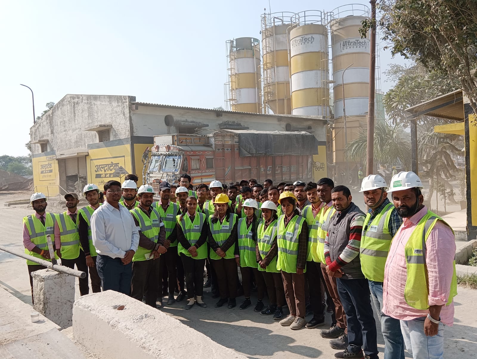 man standing in front of people sitting beside table with laptop computers