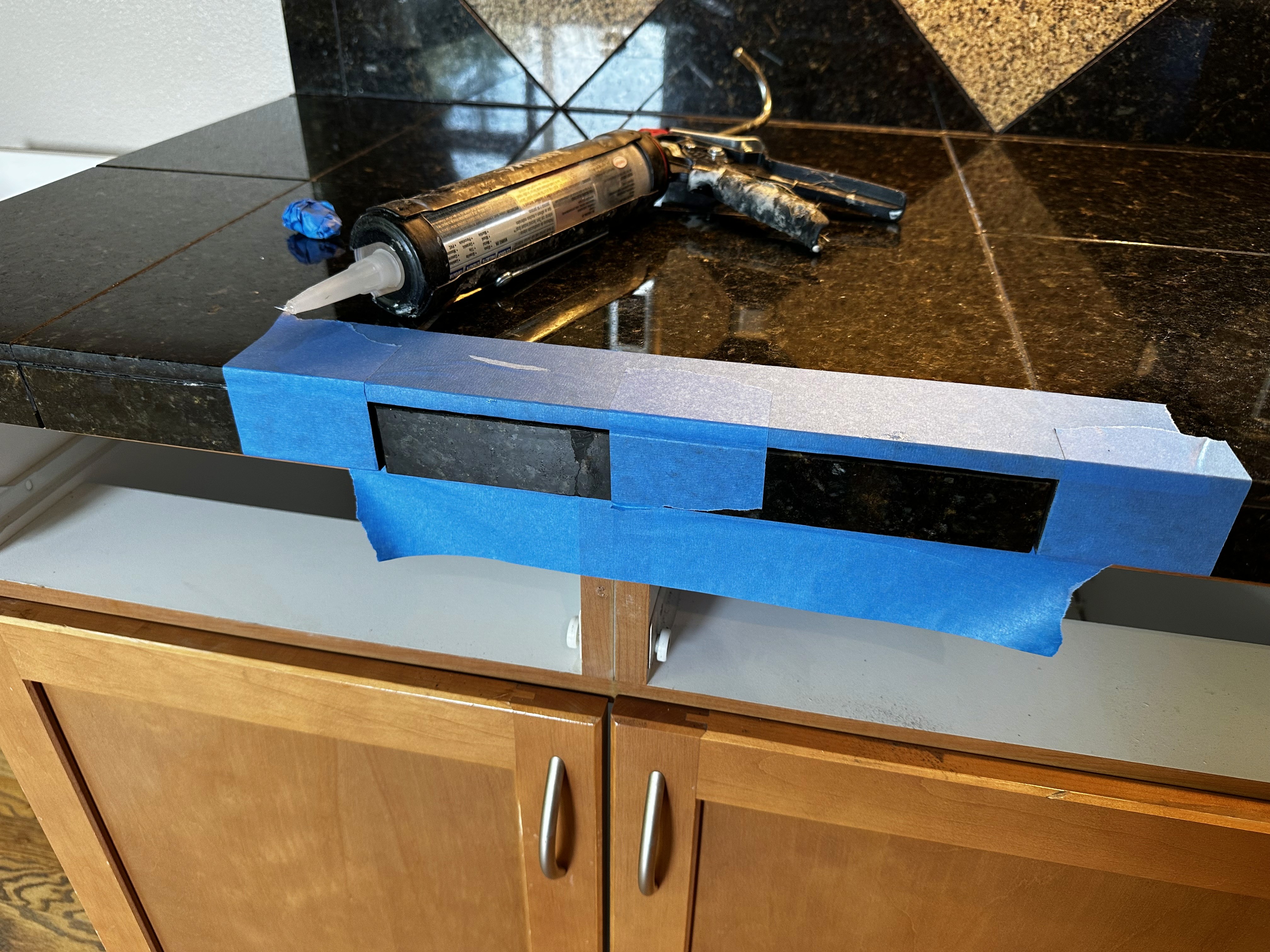 Cracked granite tile repair in rental kitchen