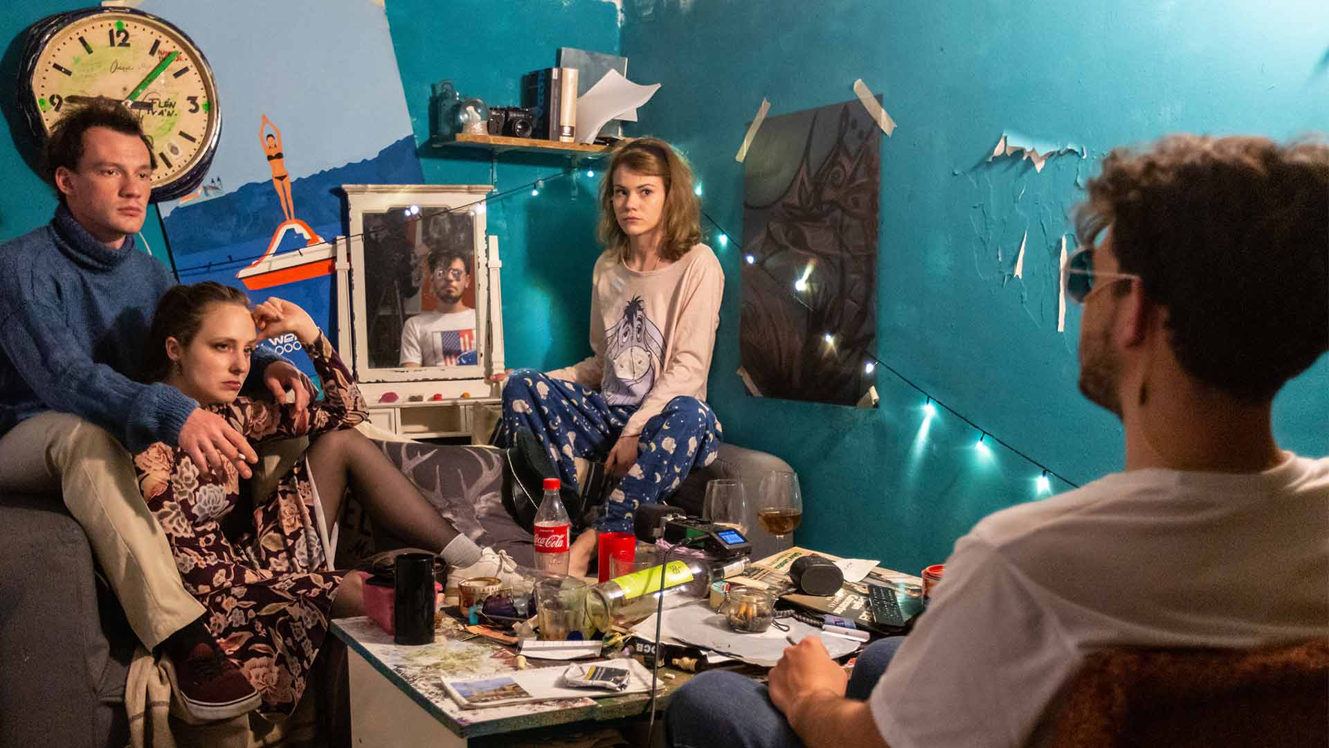 A fast black sports car races down the highway.