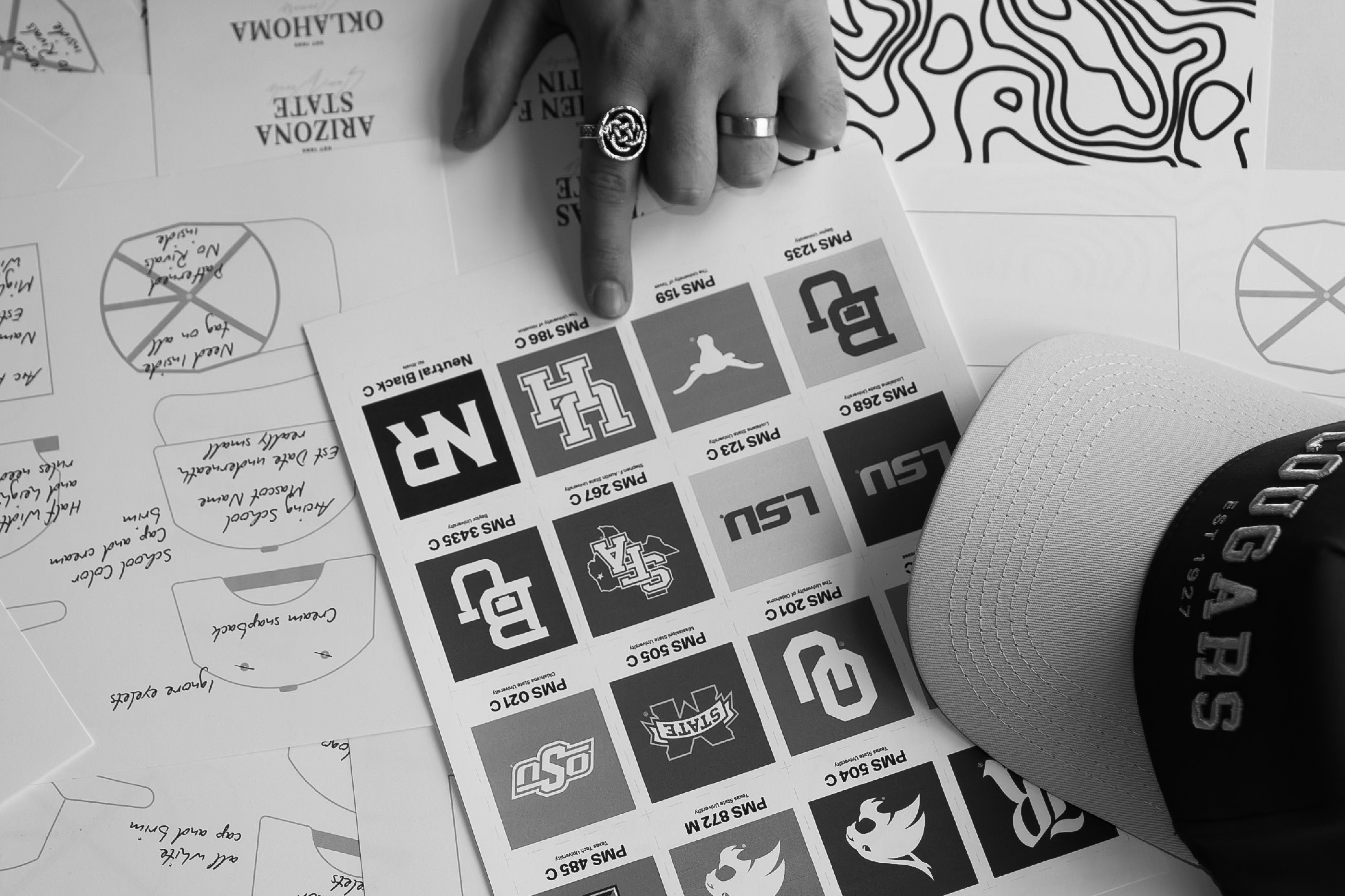 Streetside billboard with flyposters of the Batch.Works brand and illustrations