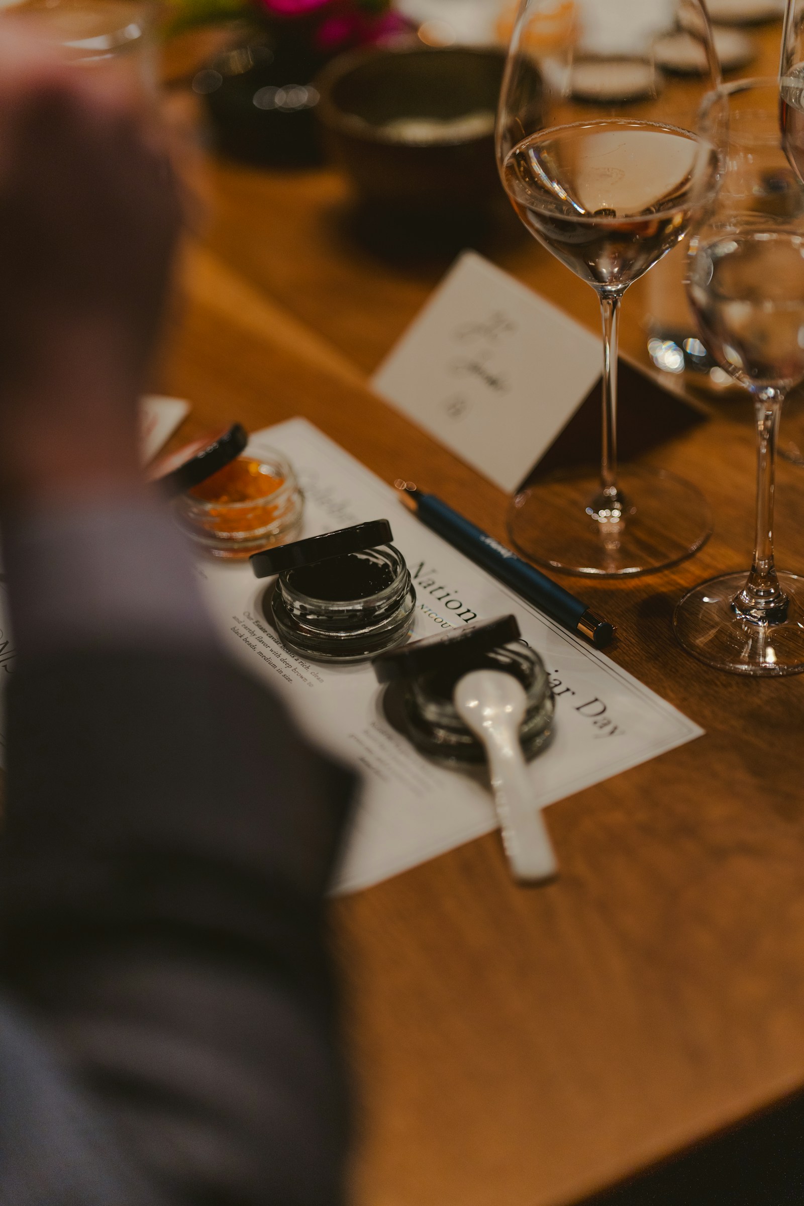 Calligraphy tools and place settings on an event table