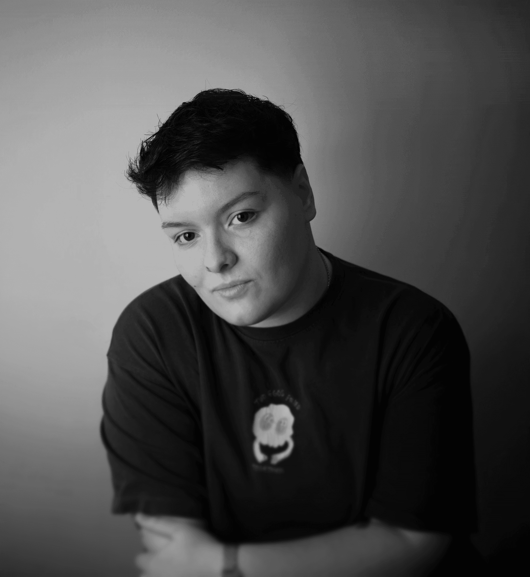 a blurry photo of a person standing in front of a wall