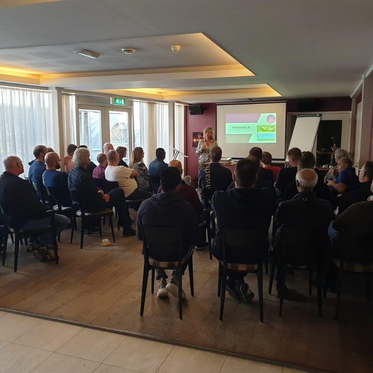 A man giving a presentation to a group of people.