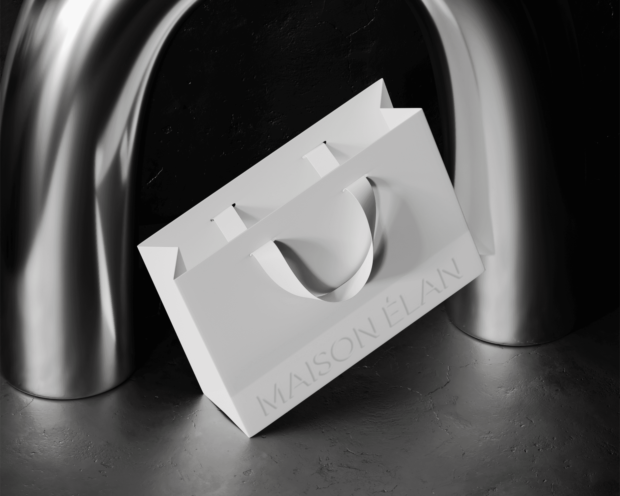A Maison Élan shopping bag. The bag is plain white with the brand logo embossed on the bottom.