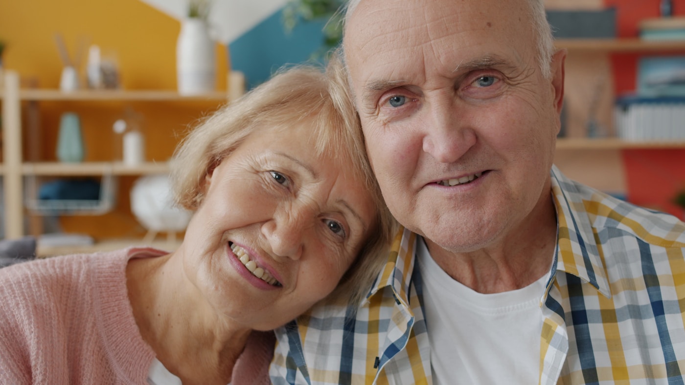 Happy couple who regained clear hearing