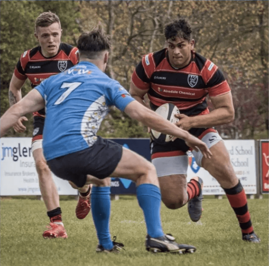 Men playing rugby