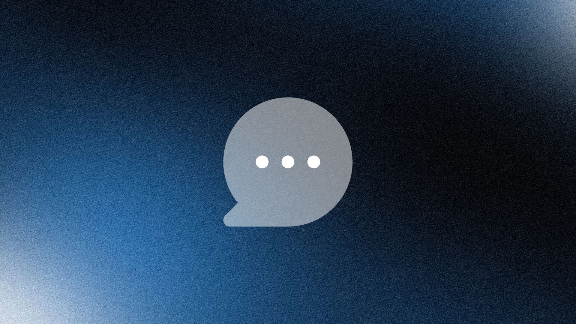 Smiling woman wearing a beige blazer and grey shirt, holding a folder while standing by a sunlit wall.