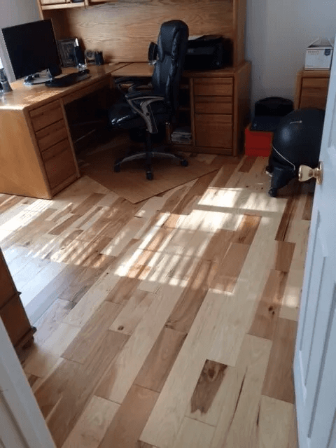 Beautiful hardwood flooring in a living room by Shilling's Carpets & Floors