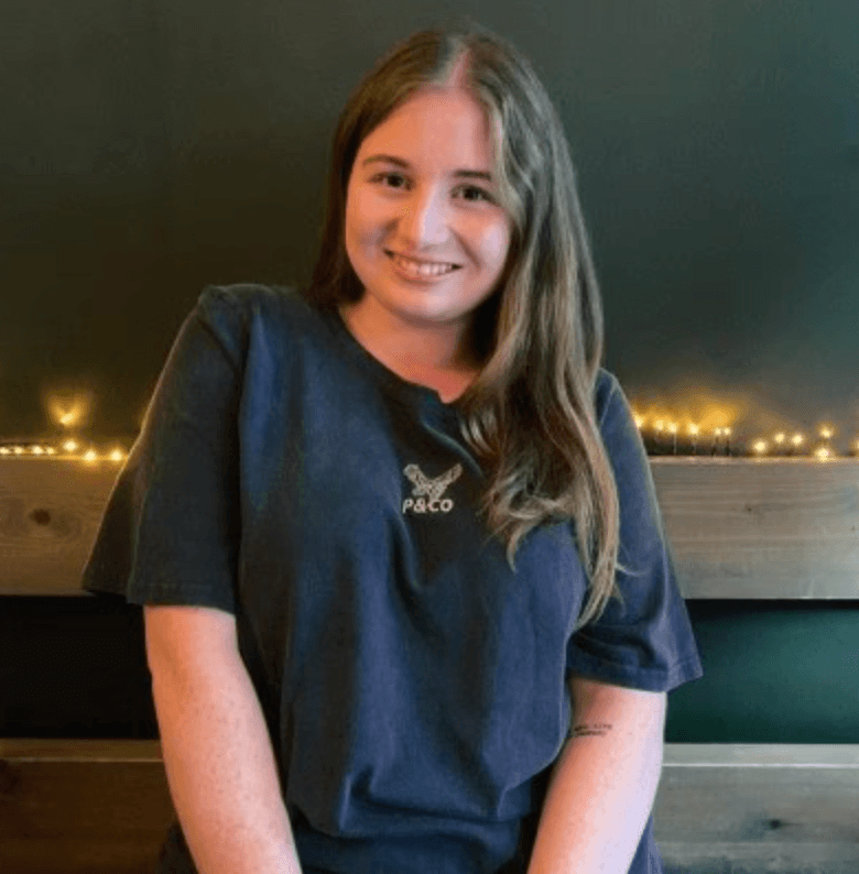 A person wearing the white shirt looking at the left