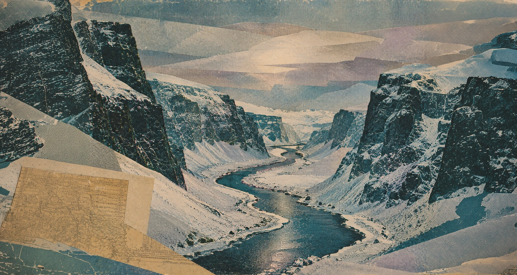 Snow-covered mountain gorge with a river running through the valley