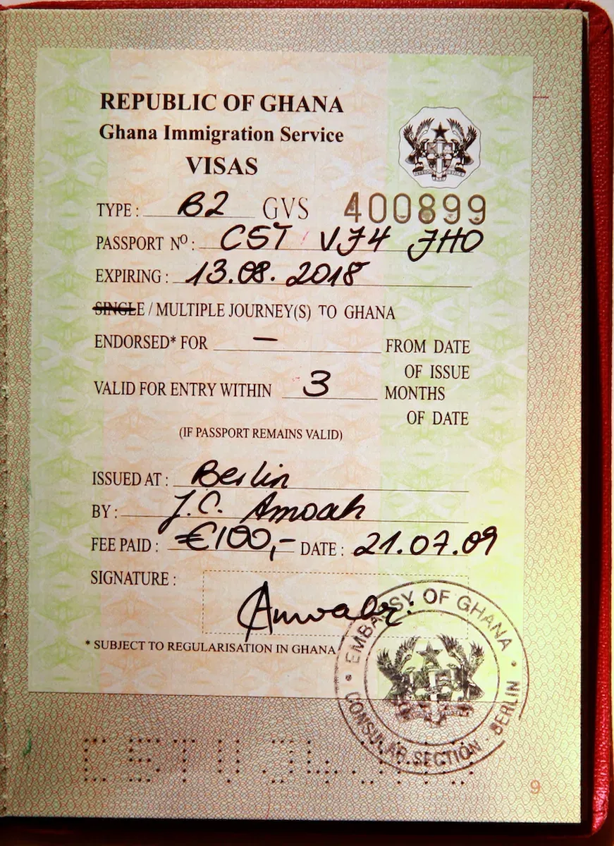 Close-up of Ghana visa issued inside a passport.