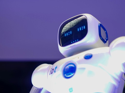 a futuristic-looking robot with a sleek design, featuring a digital display on its face, likely representing advancements in robotics or artificial intelligence.