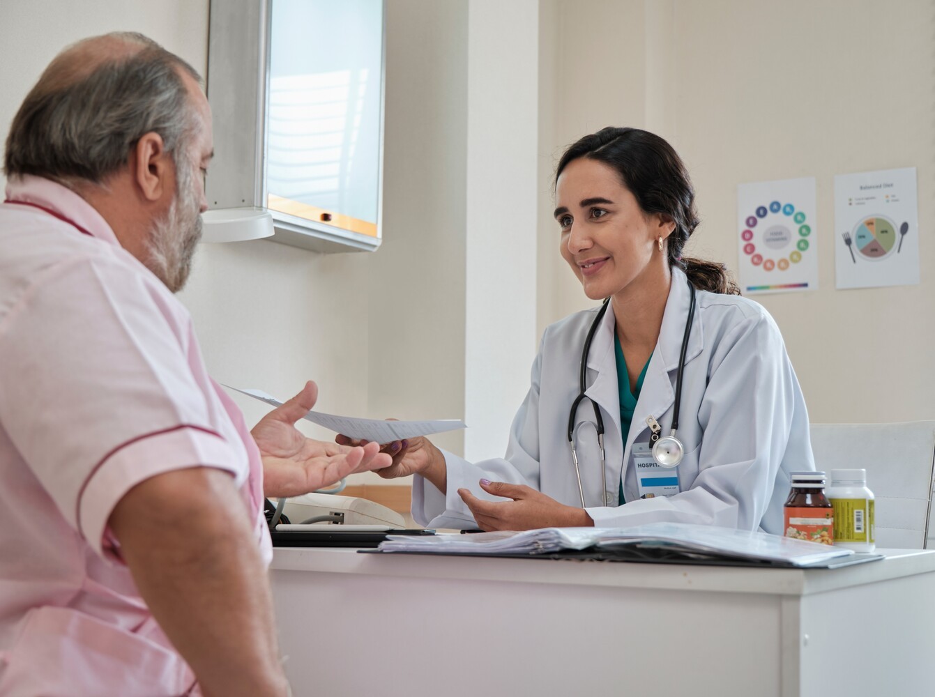 older man meeting with a dietitian to discuss lifestyle support for his weight loss drug that has been FDA-approved