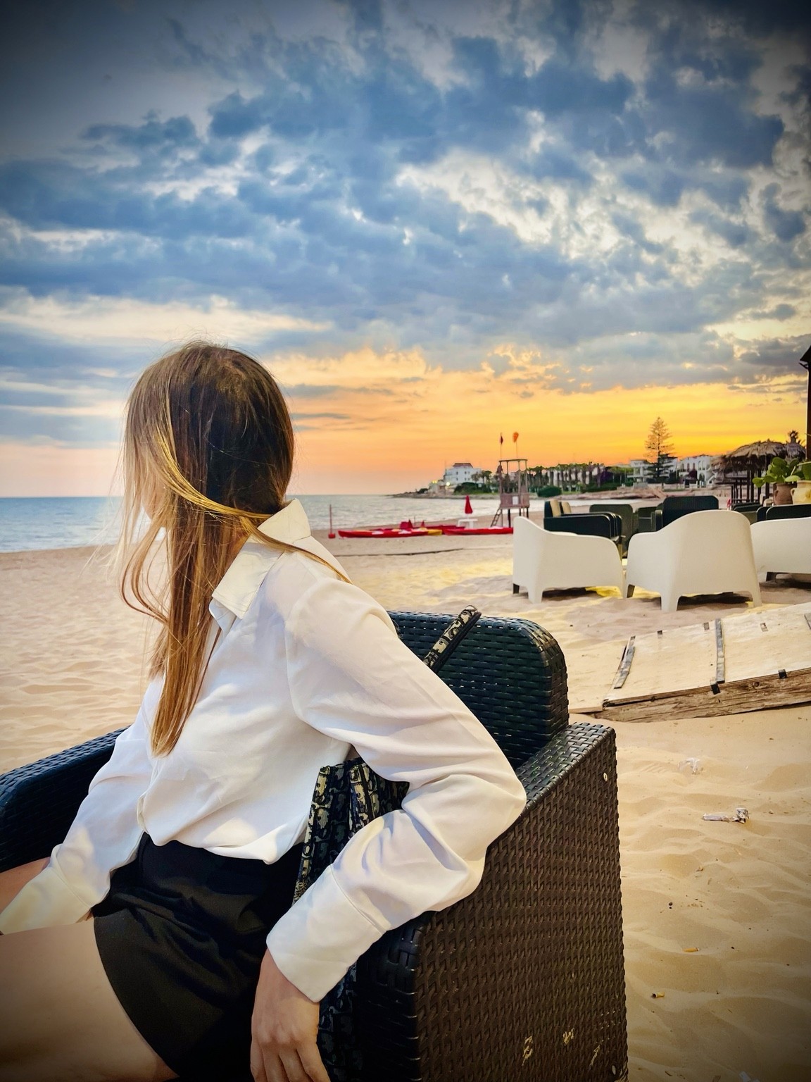 Susan Constantine looking toward the sea at sunset