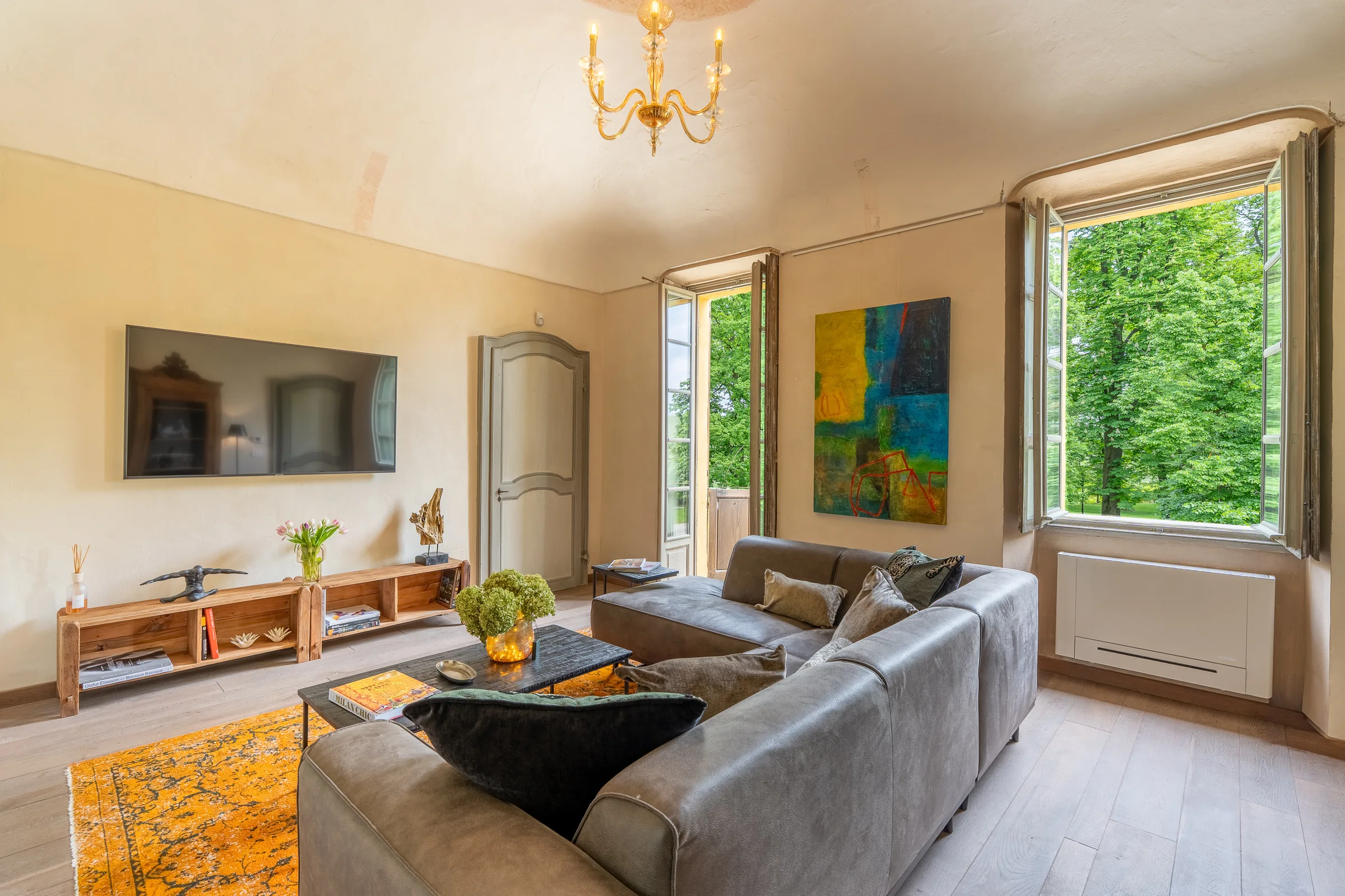 Yellow living room with period furniture — Nizza Monferrato, Italy. Photography by Yunes Calore.