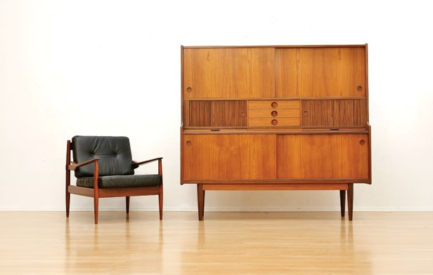 A modern armchair and cabinet.