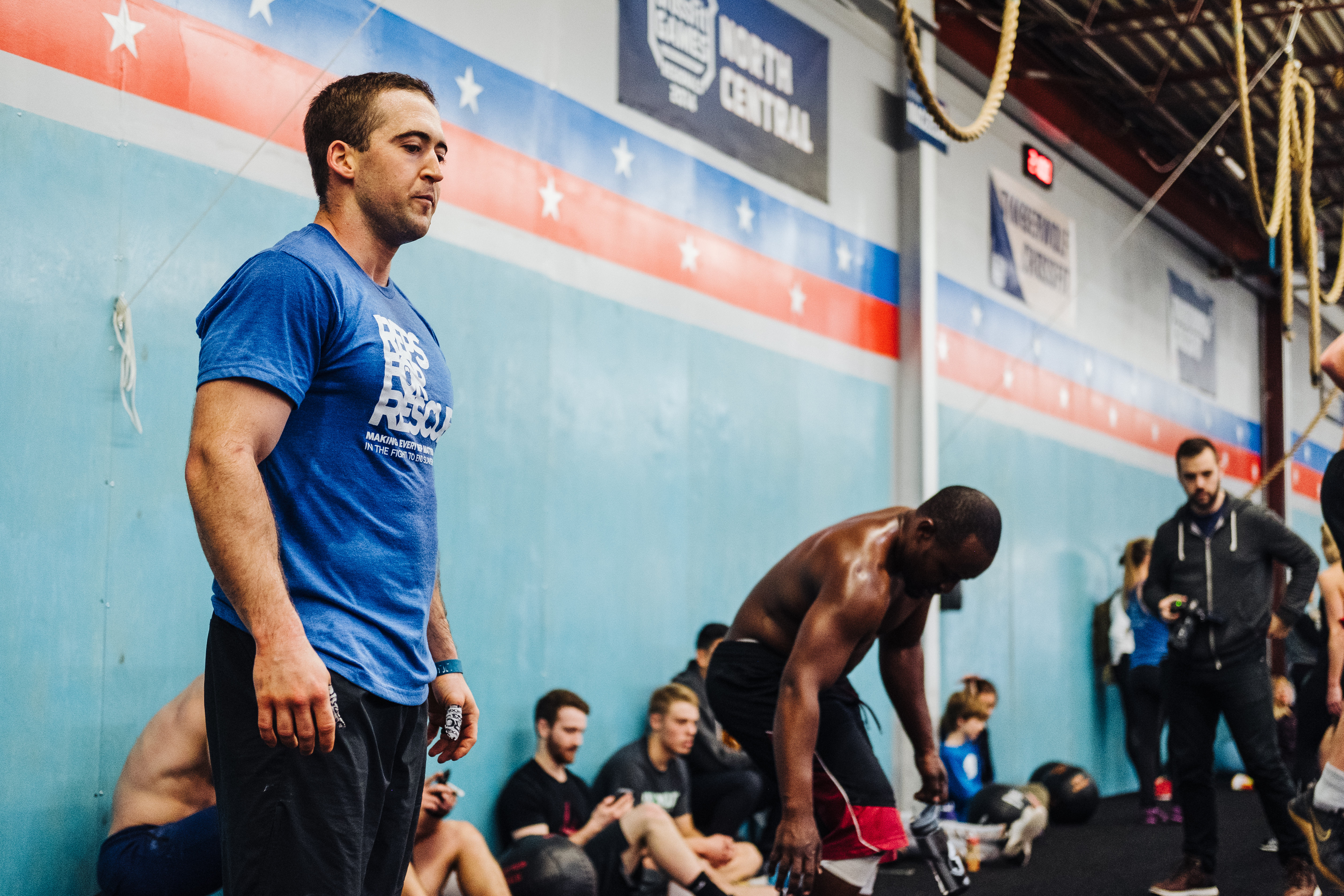 man about to lift weights at a crossfit gym