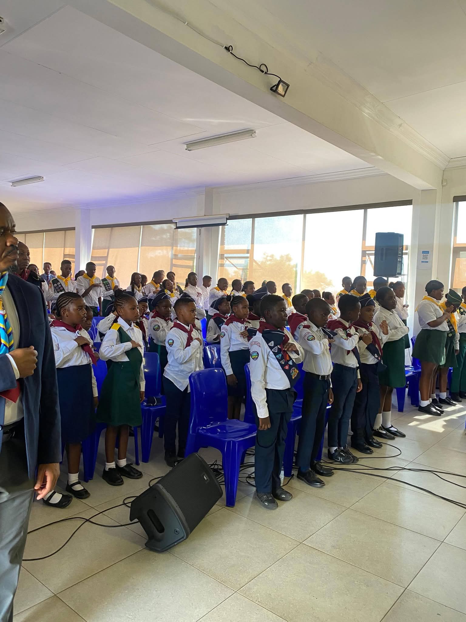 a woman sitting on a rock with a dog