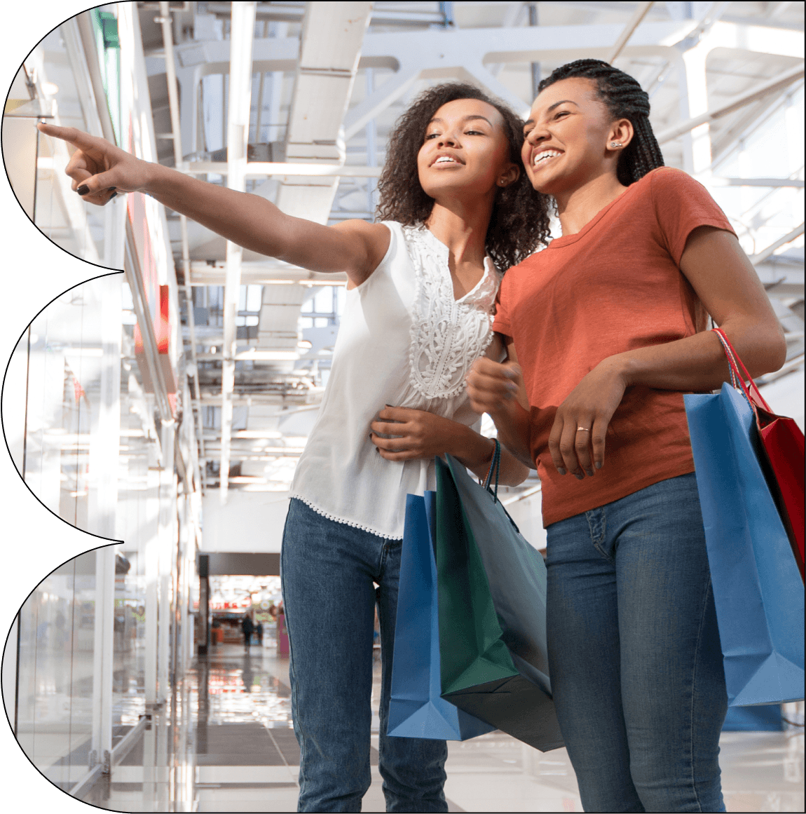 Two young women are shopping in a store, smiling and pointing at something on the shelf. They are carrying shopping bags. Around the image, there are logos of well-known retailers like eBay, Adidas, and Amazon, suggesting that Breezy is accepted at various stores.