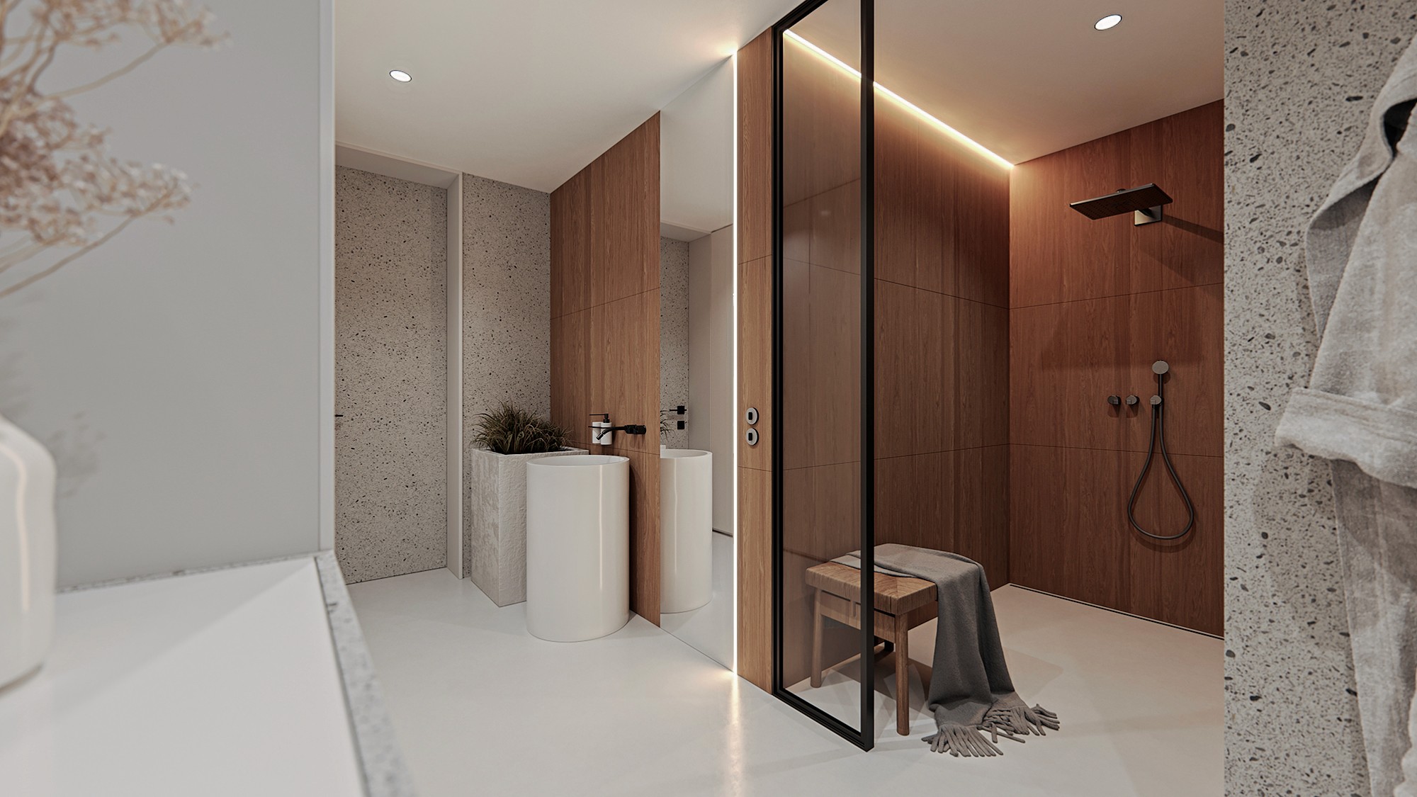 Contemporary bathroom combining stone surfaces, wood details and soft lighting