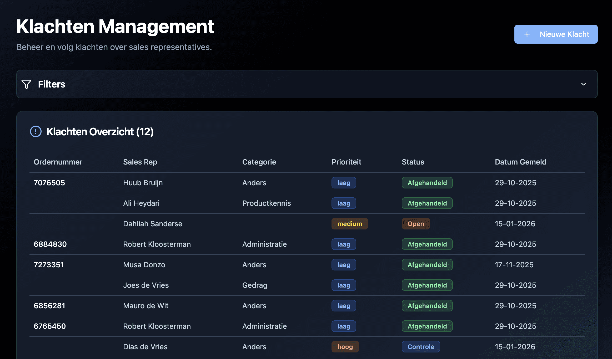 A hand holding a black pen, poised to write or draw on a surface.