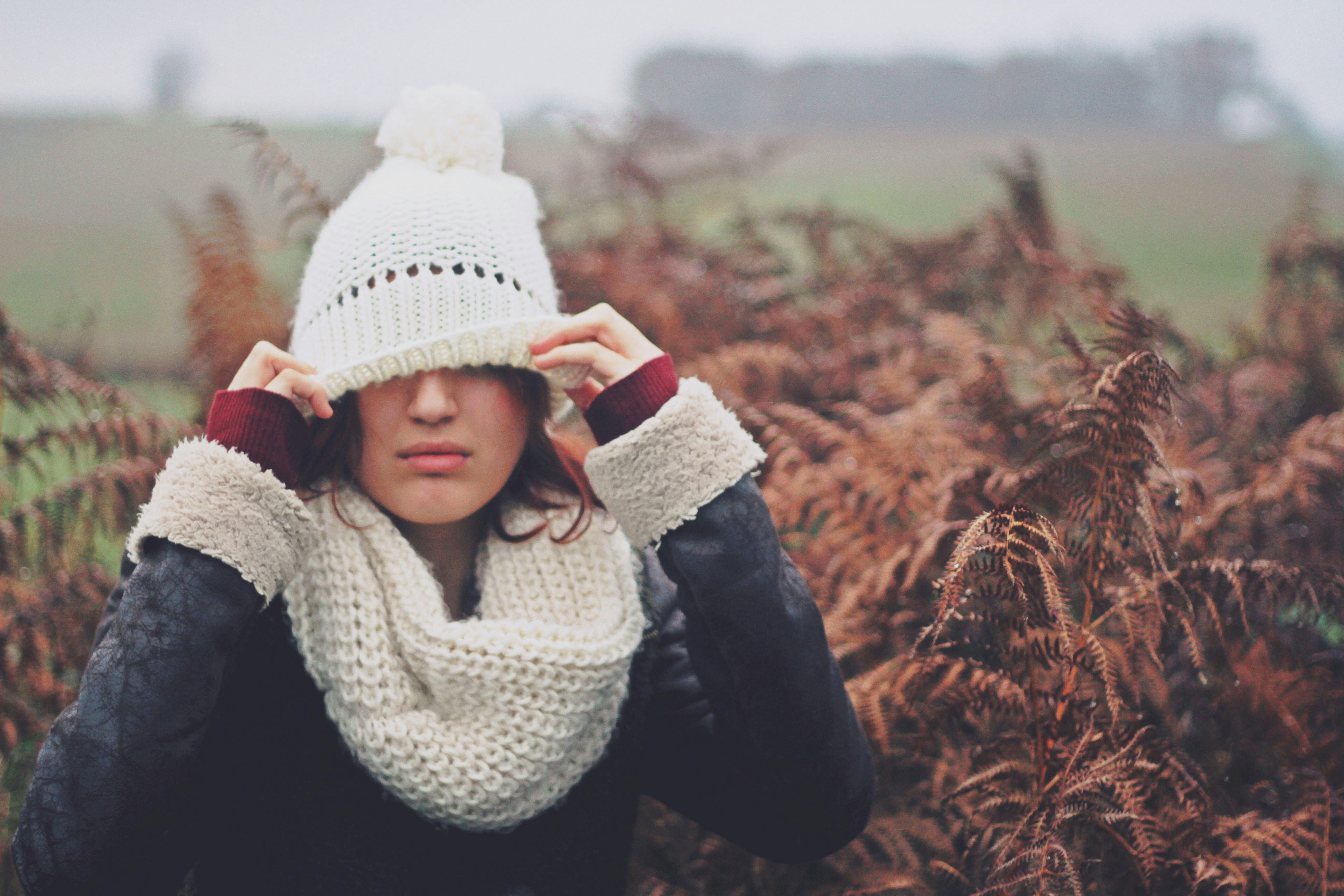 woman trying to adjust in winter cloths - Winter Color Analysis