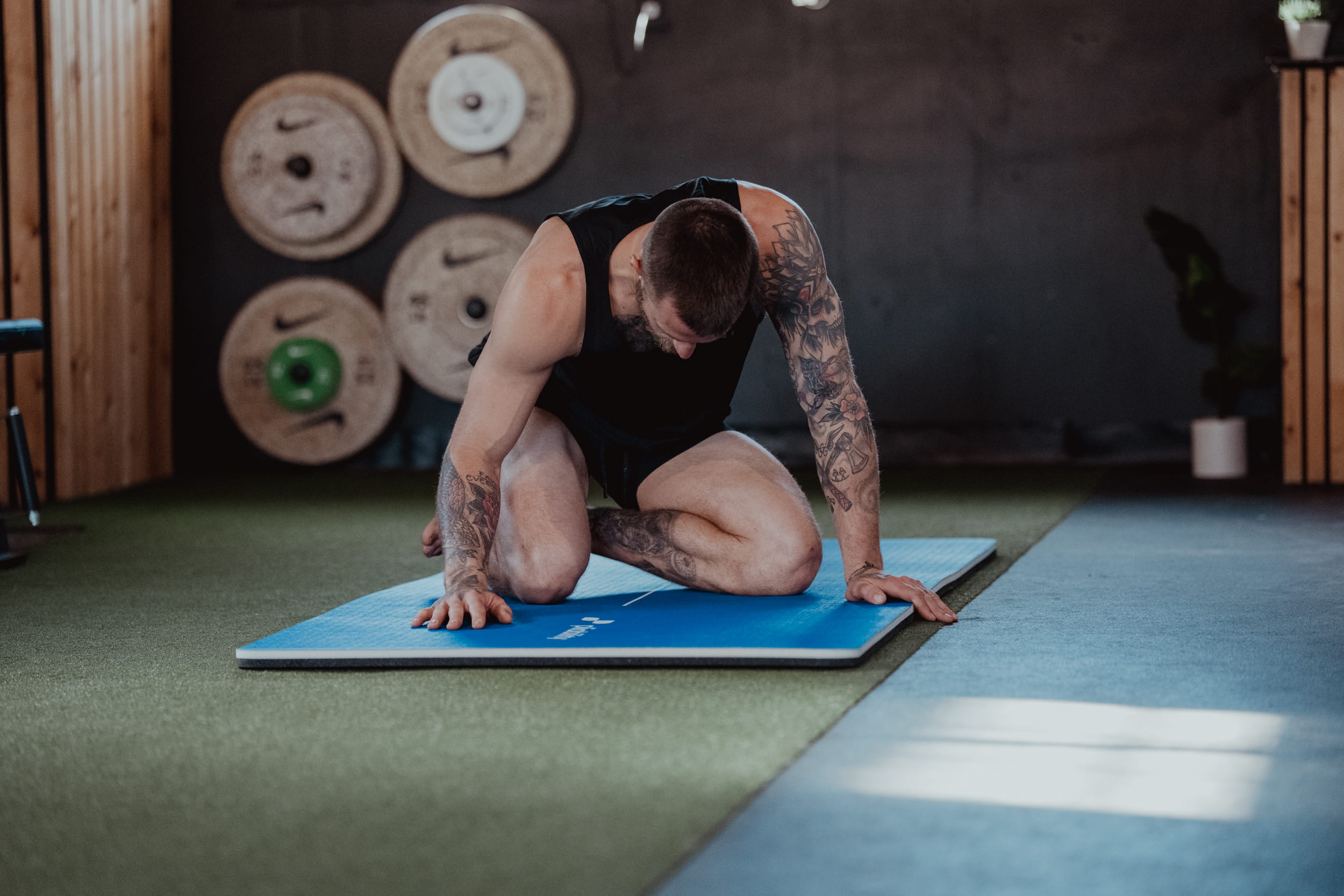 person on mat - What Causes Knee Stiffness