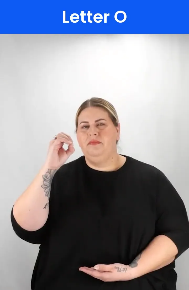 A Deaf signer signs O in ASL